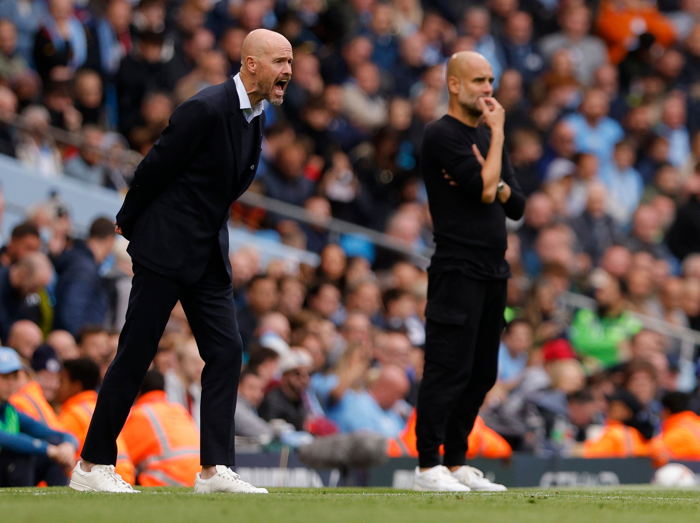 Erik ten Hag (left) reacts during Manchester United’s demolition by City