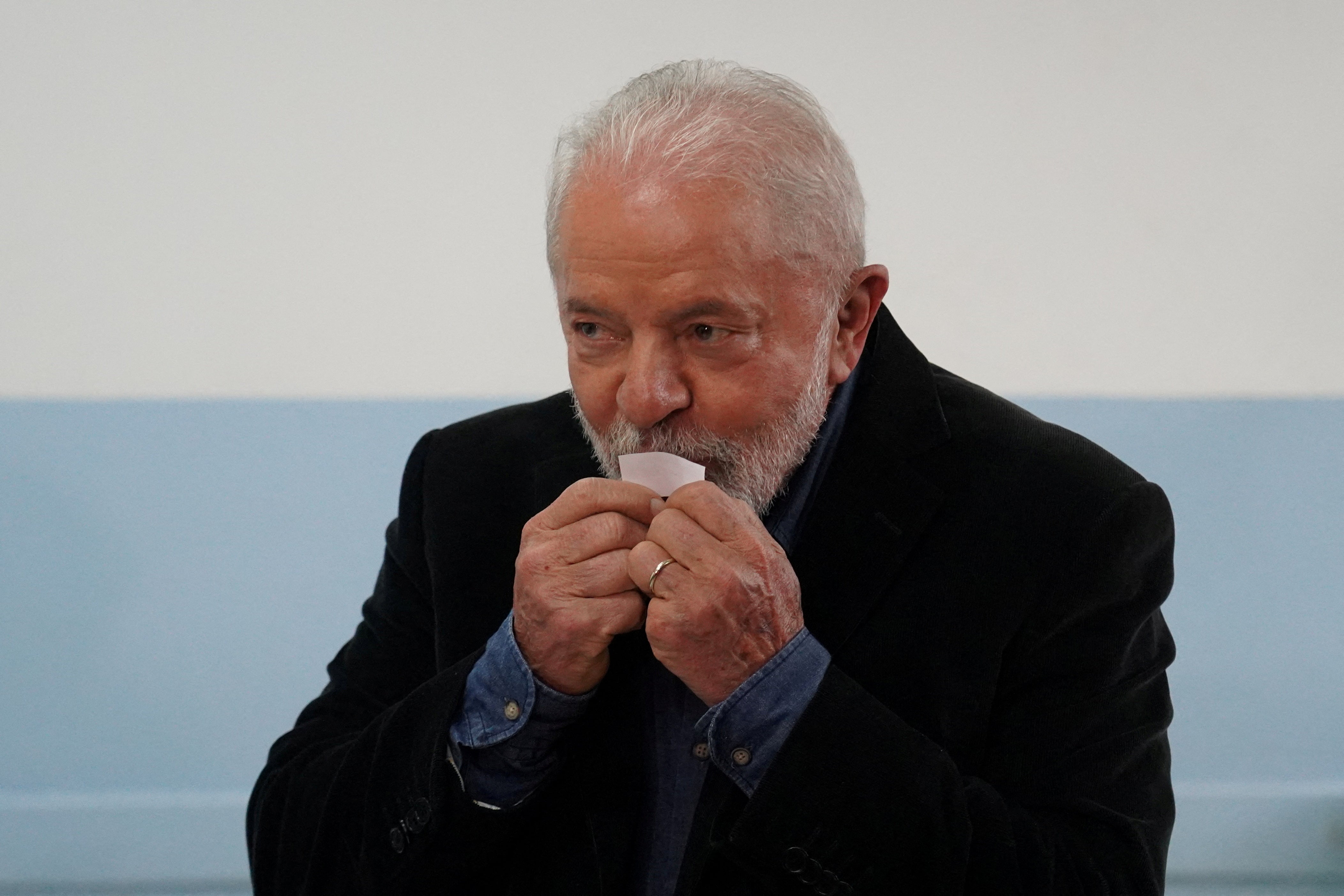 Luiz Inacio Lula da Silva votes at a polling station during the presidential election