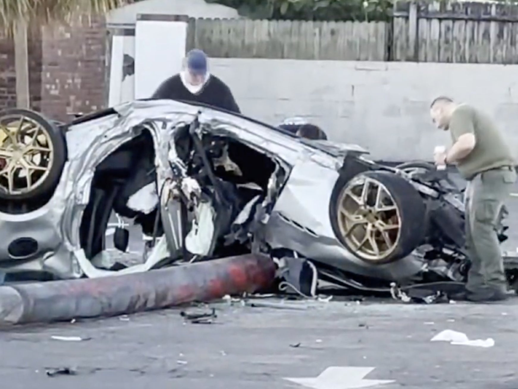 Pinellas County officials examine the wreckage of a Maserati that had been allegedly stolen by a group of teens. The teens allegedly crashed the vehicle, killing one and seriously injuring the others