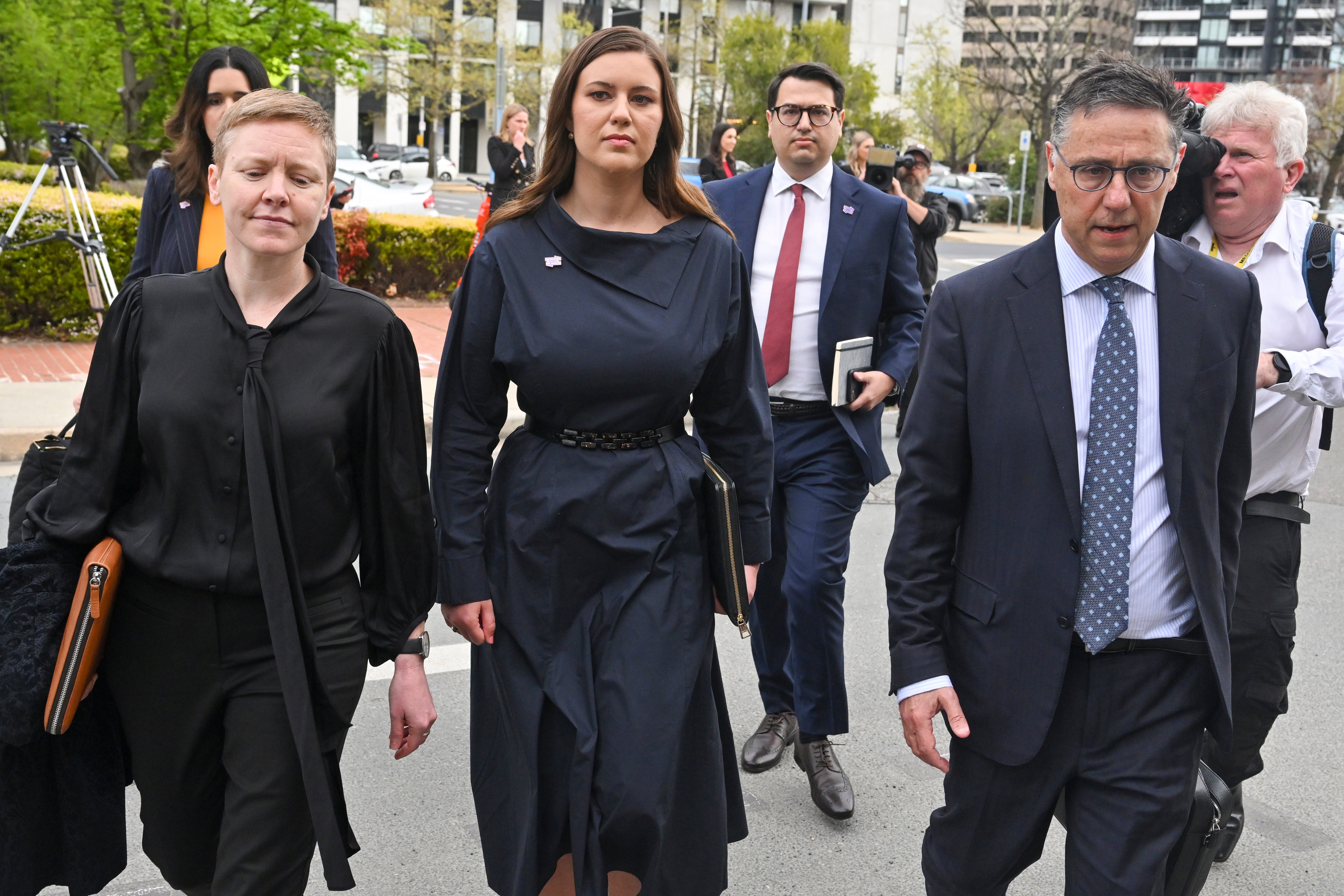 Former Liberal staffer Brittany Higgins (centre) arrives at the Australian Capital Territory Supreme Court in Canberra