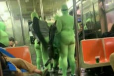 Six women in neon green jumpsuits rob and beat two women on NYC subway