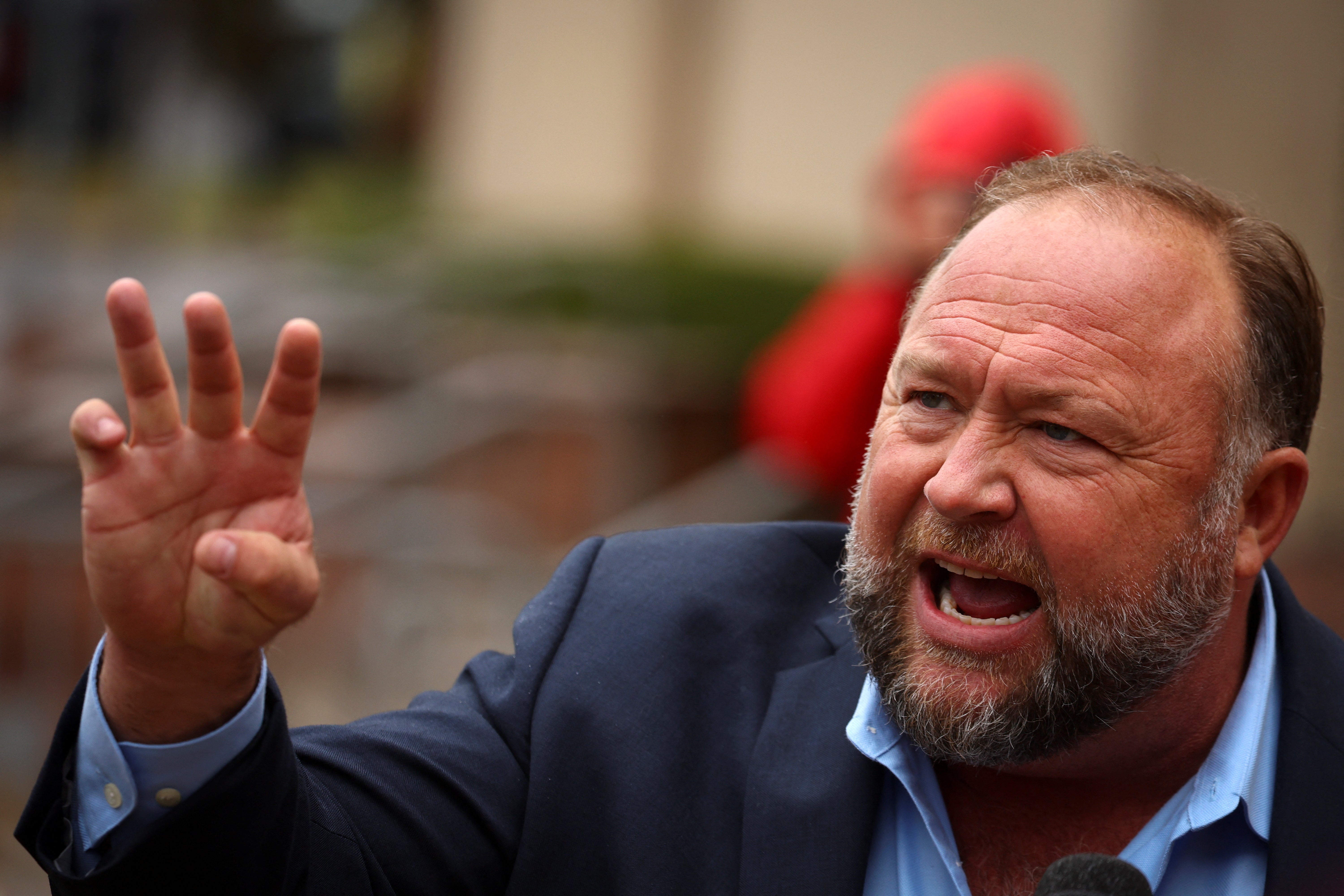 Alex Jones speaks to reporters outside his Sandy Hook defamation trial in Waterbury, Connecticut