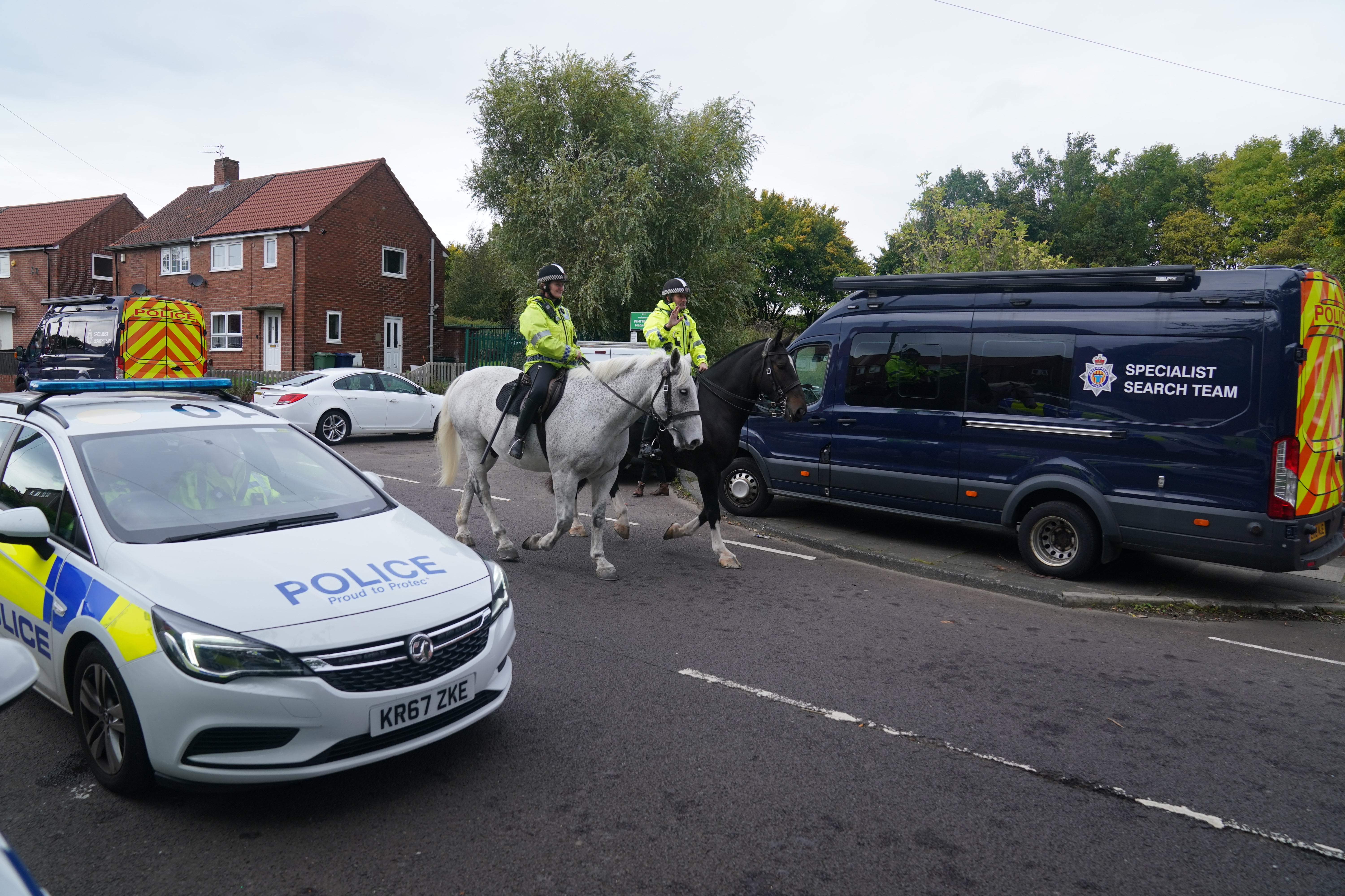 Mounted police patrol the area close to the scene on Aycliffe Crescent, Gateshead, where a 14-year-old boy was fatally attacked