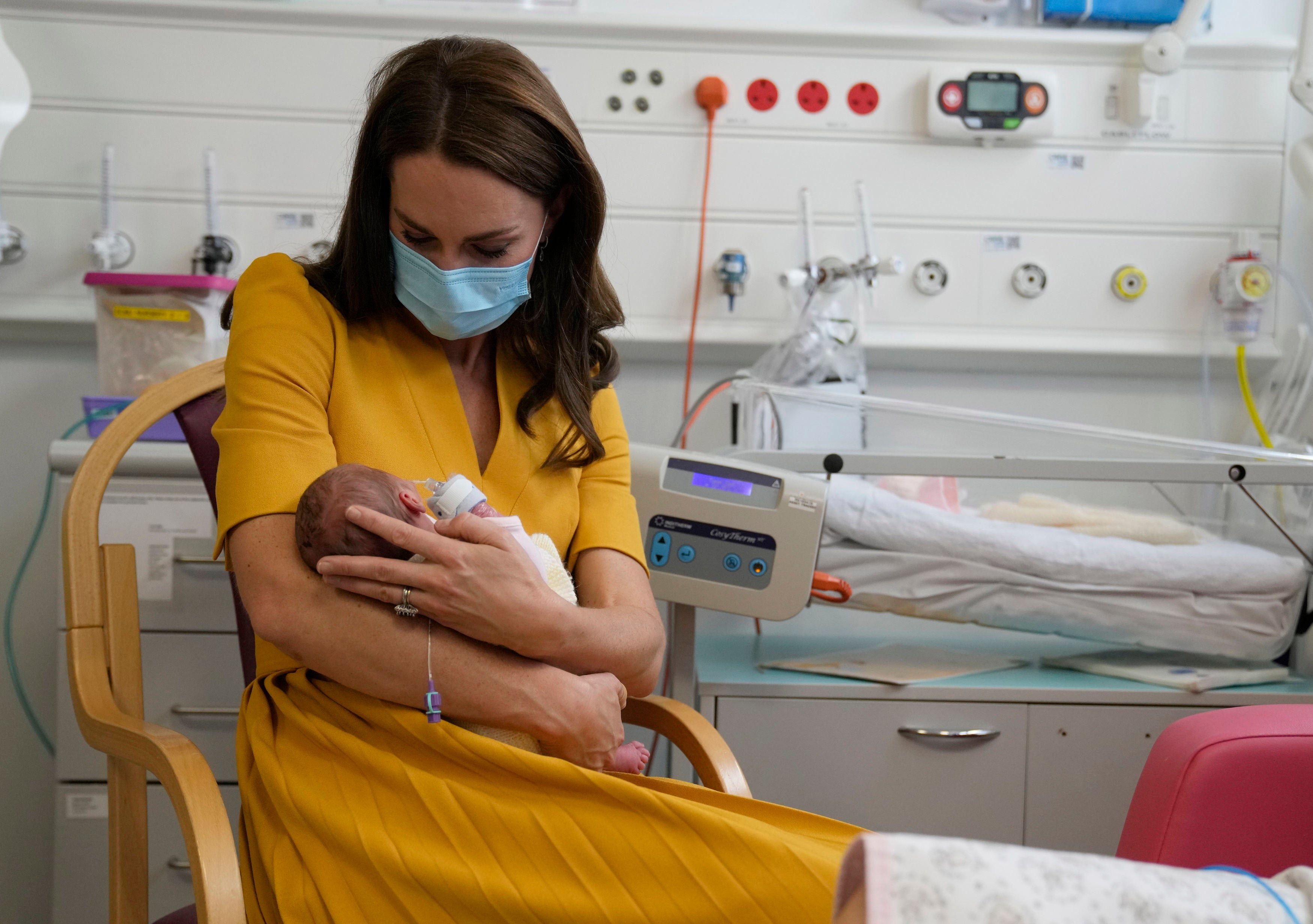 Kate holds newborn Bianca