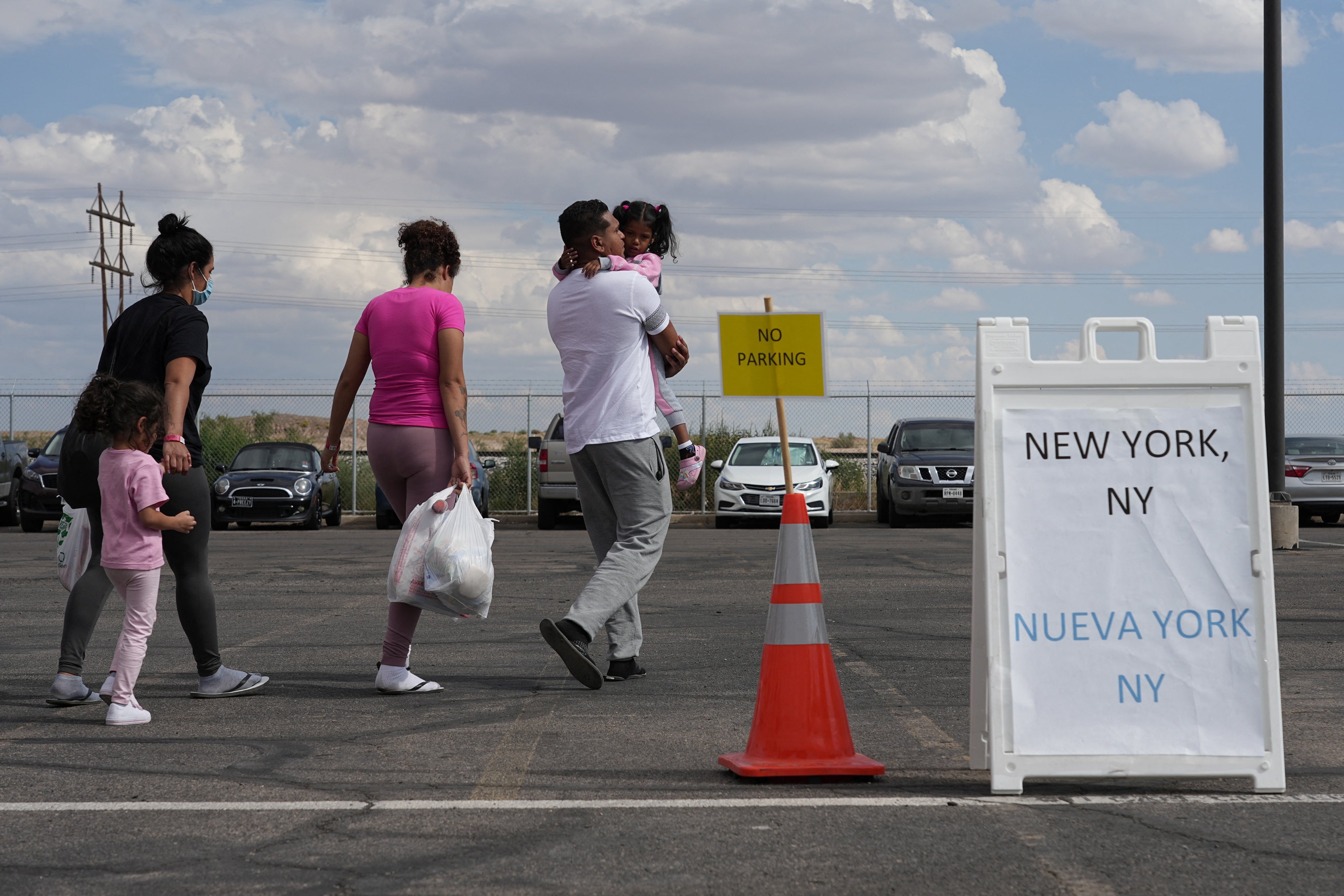 A family from Venezuela boards buses to New York from El Paso, Texas on 3 October