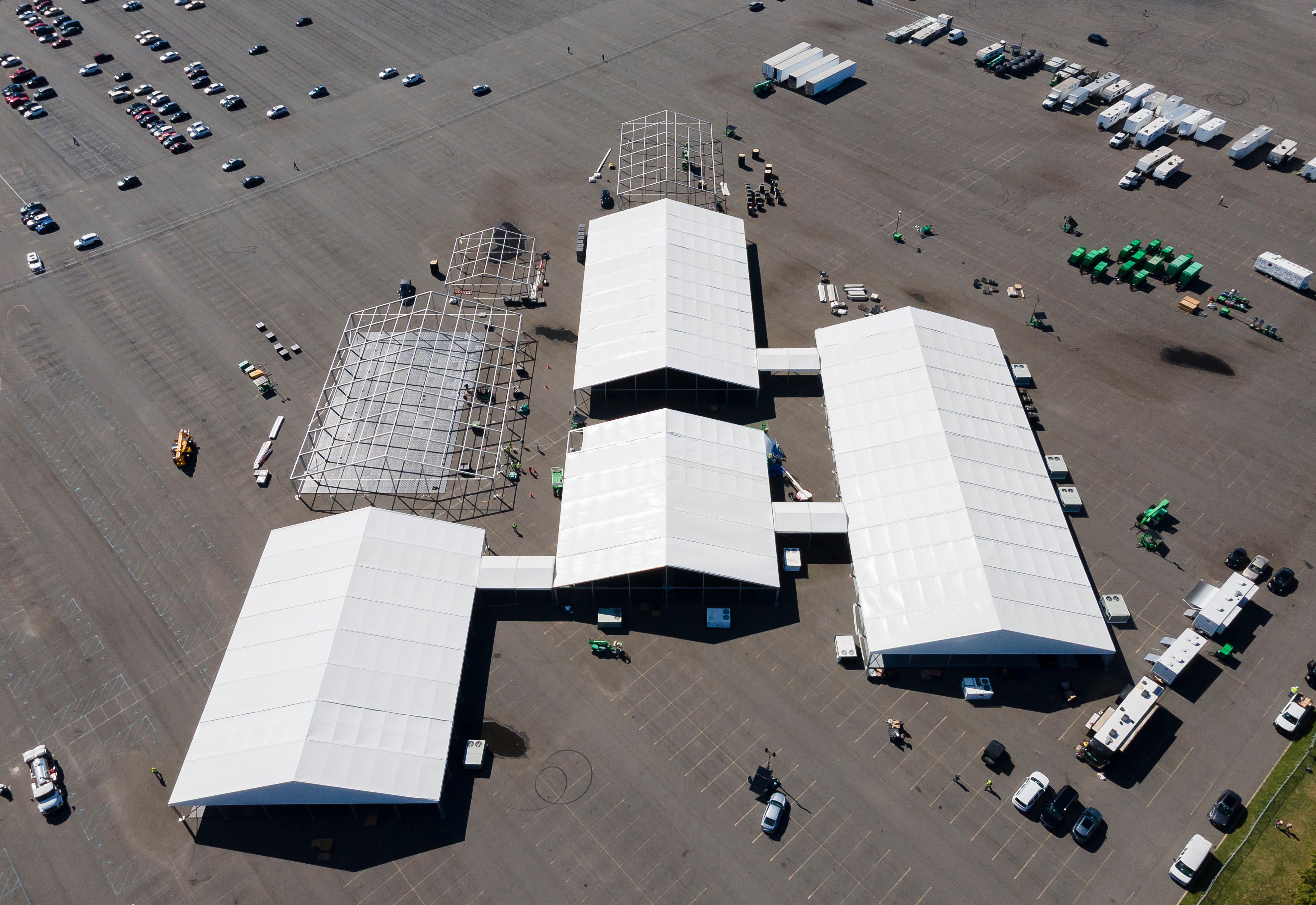 An aerial photo shows New York City’s initial emergency tent facilities in The Bronx before it was disassembled days later due to flood risk. The city is now using a lot on Randall’s Island for its shelter plan