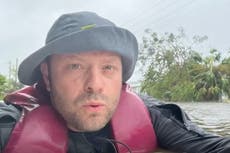 Son films himself swimming to save elderly mother from Hurricane Ian floods