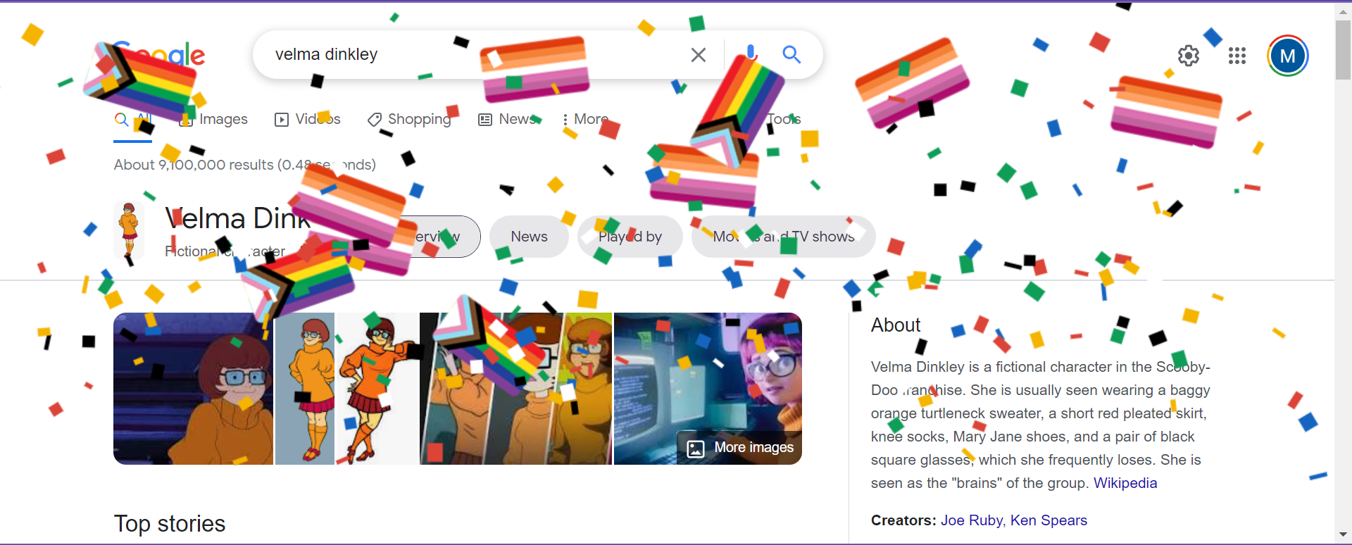 A burst of confetti and LGBT+ flags casecade over the Google search results page for ‘Velma Dinkley’