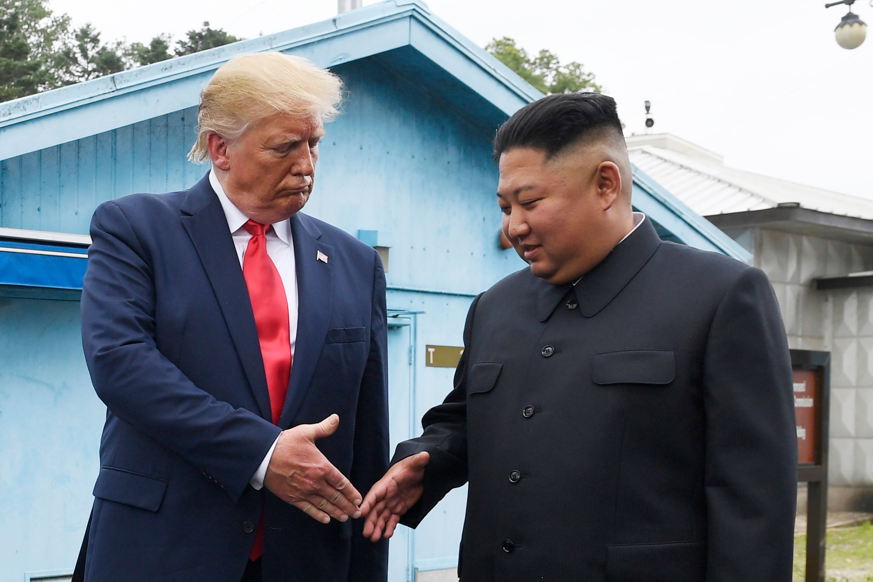 Kim Jong-un with Donald Trump at the border village of Panmunjom in the Korean Demilitarized Zone in 2019