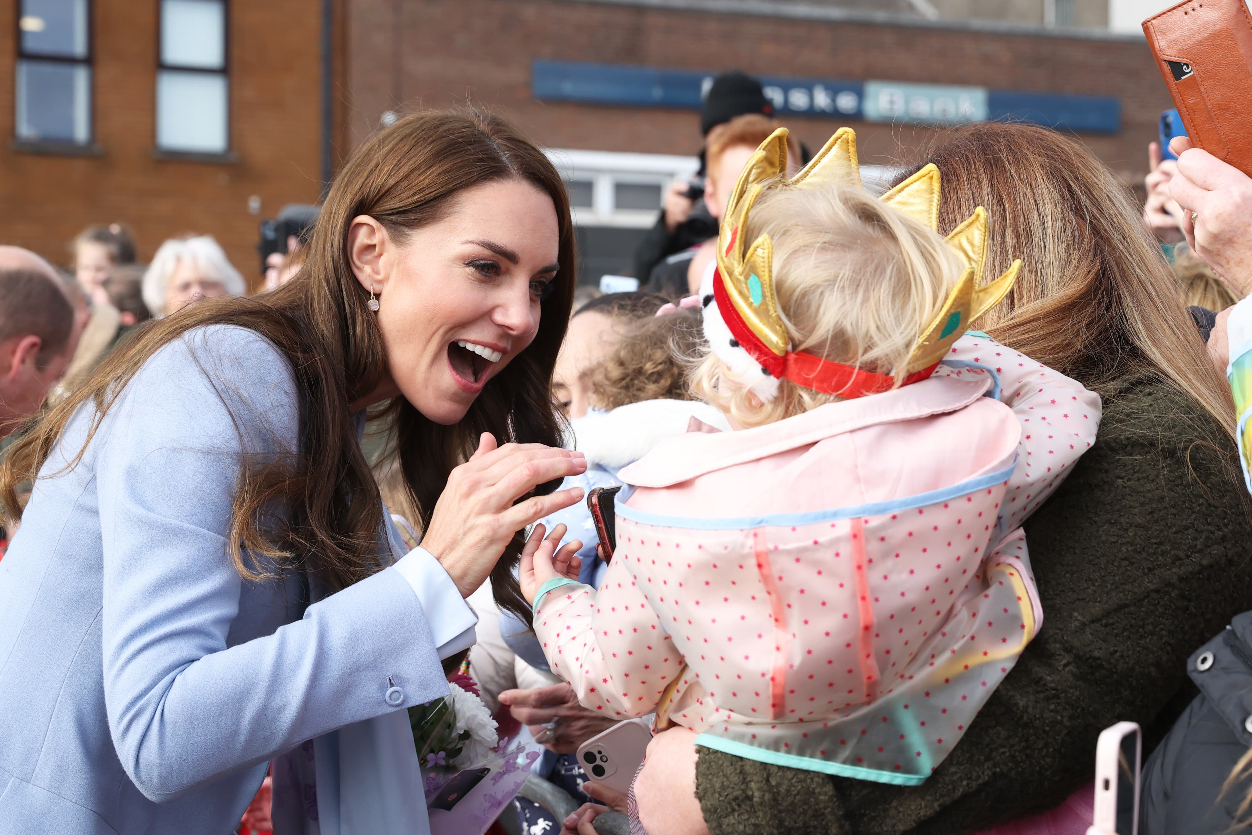 The Prince and Princess of Wales meet members of the public during a walkabout outside Carrickfergus Castle in Carrickfergus (Liam McBurney/PA)