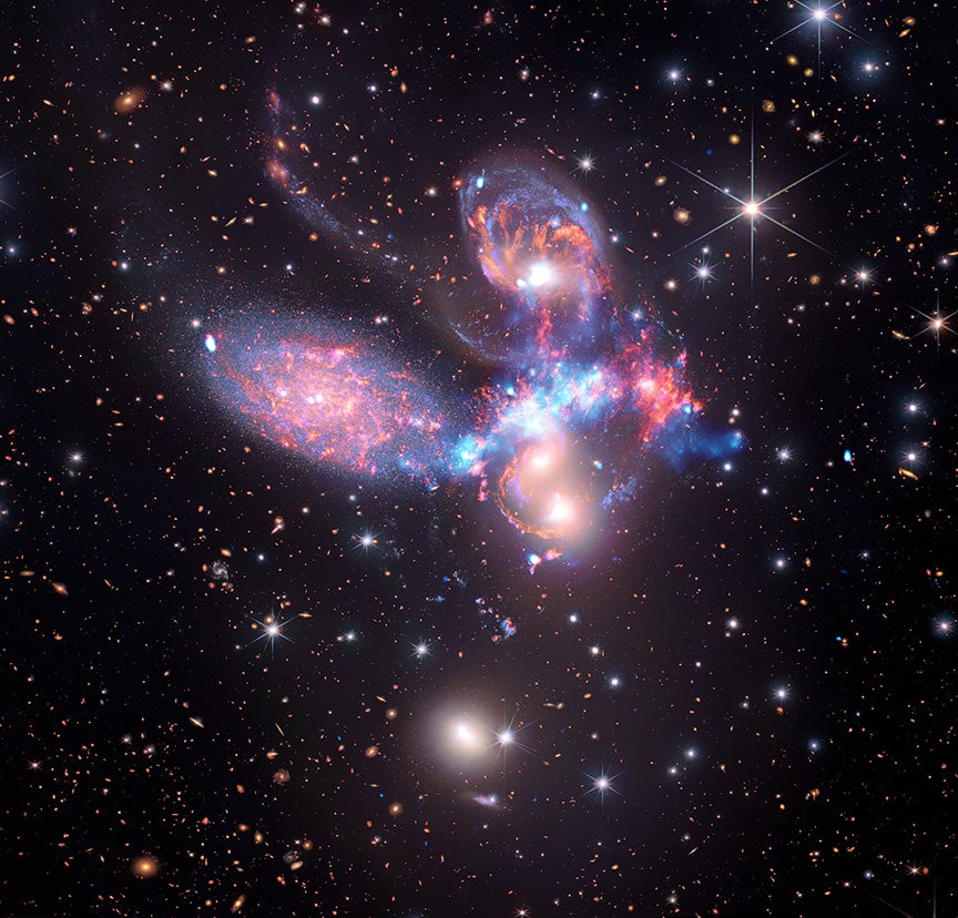 This image of the group of galaxies known as Stephen’s Quintet was created by combining infrared light observations by the James Webb Space Telescope with X-ray light observations from the Chandra X-ray Observatory, revealing new details