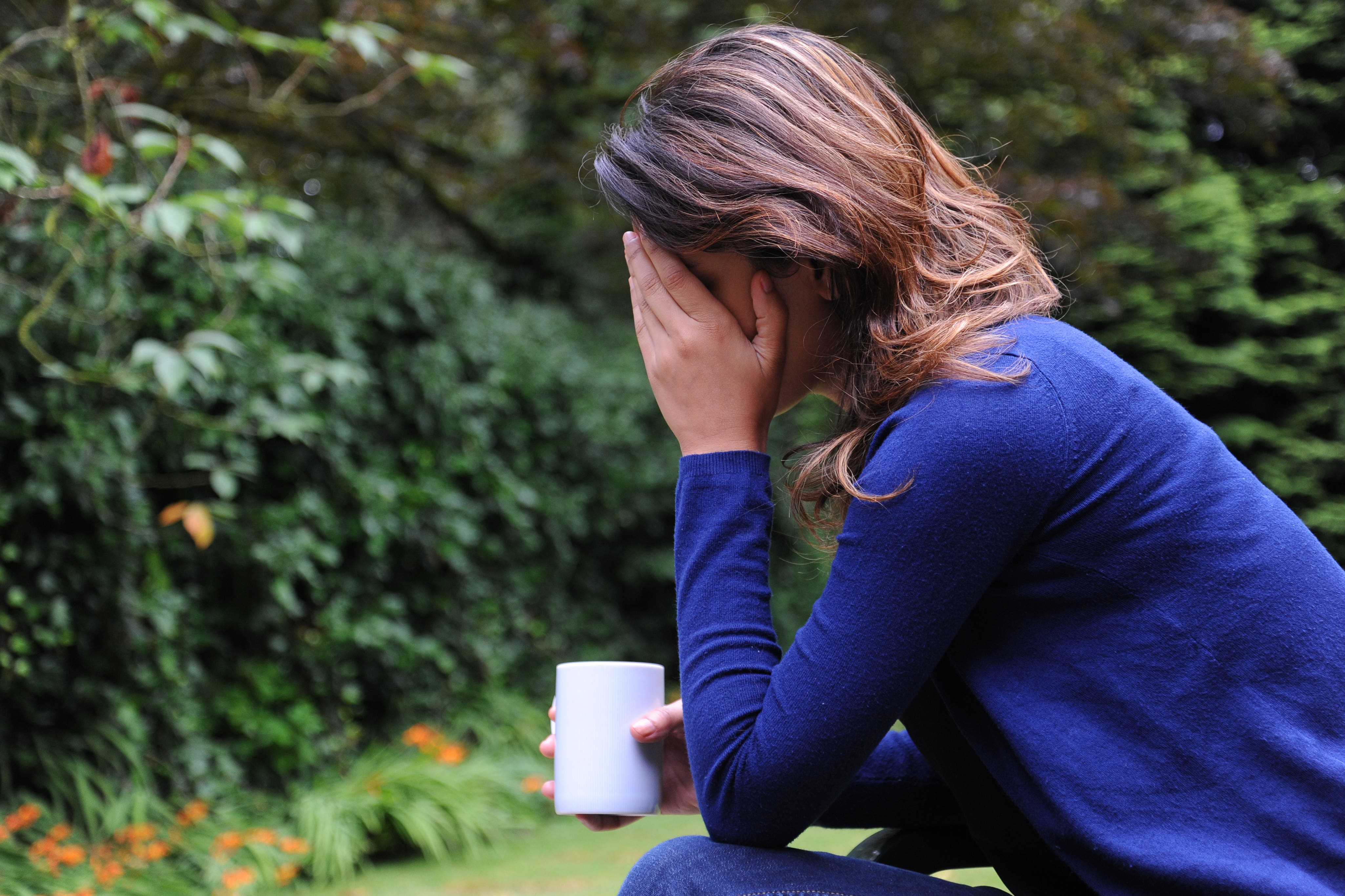 A woman showing signs of depression. (Anna Gowthorpe/PA)