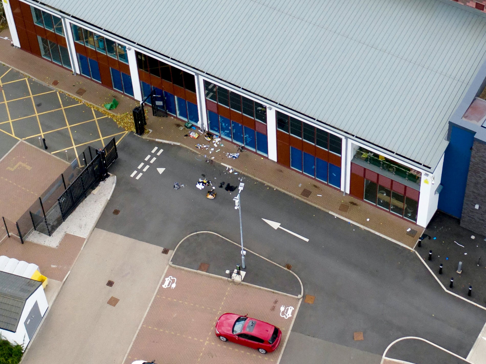 Photographs show what appears to be remnants of where somebody received emergency medical treatment in the car park