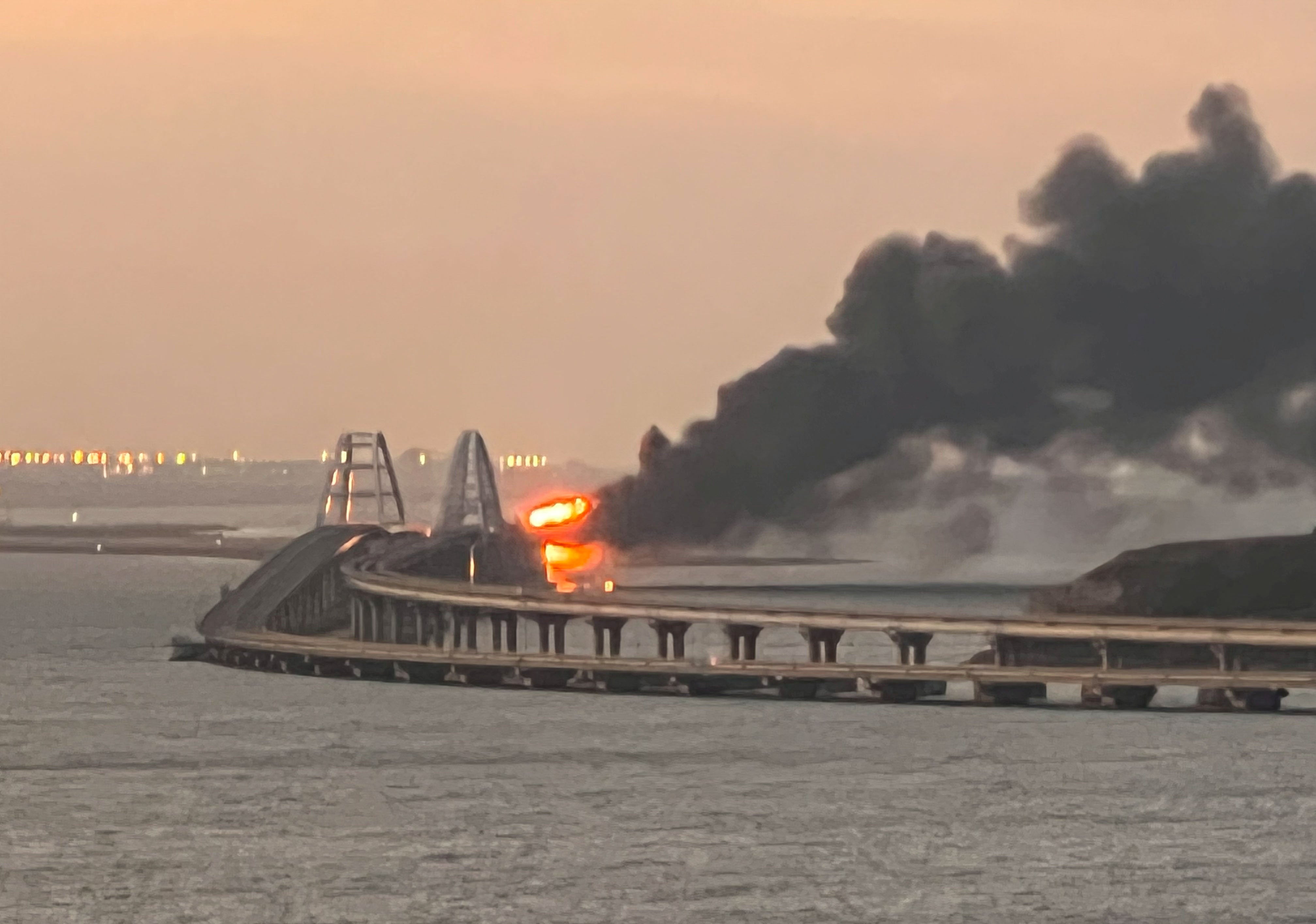 Ukraine news – live: Fire erupts on crucial bridge linking Russia to Crimea as blasts rock Kharkiv