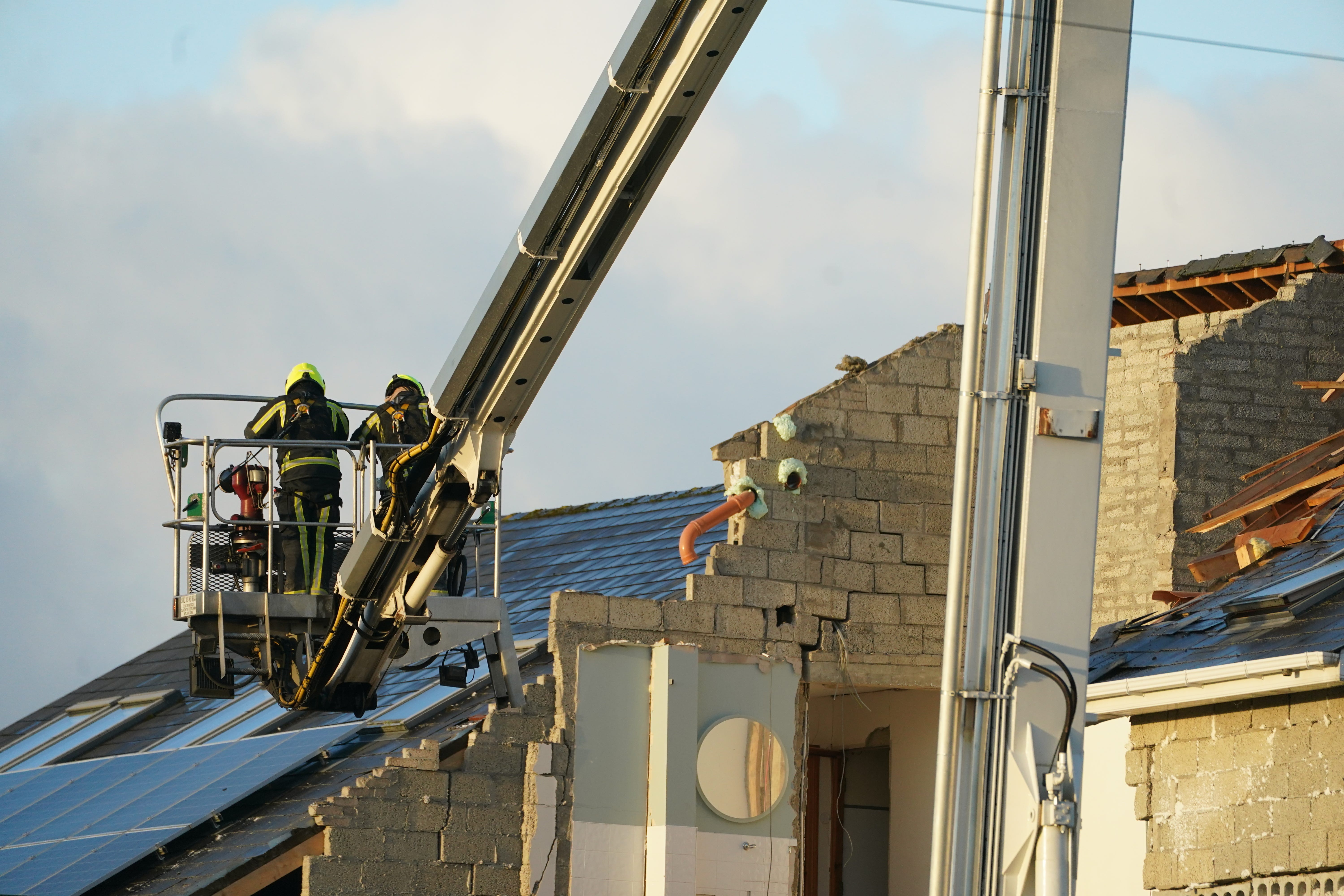 Emergency services continue their work at the scene of an explosion at Applegreen service station in the village of Creeslough in Co Donegal (Brian Lawless/PA)