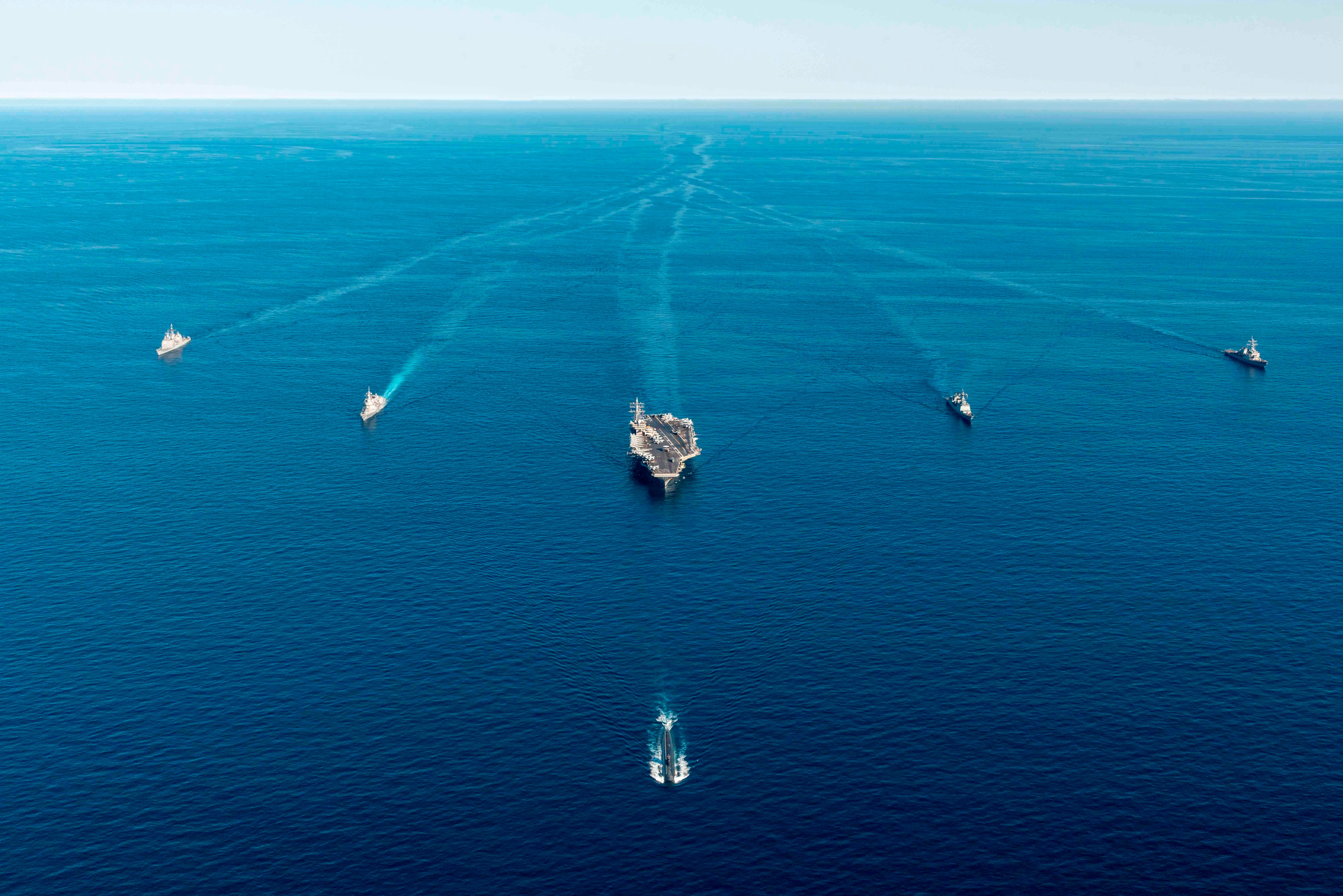 The USS Ronald Reagan aircraft carrier, center, participates in a joint anti-submarine drill among South Korea, the United States and Japan