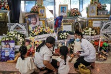 Grieving families mourn through night in temples after 23 children massacred at Thailand nursery