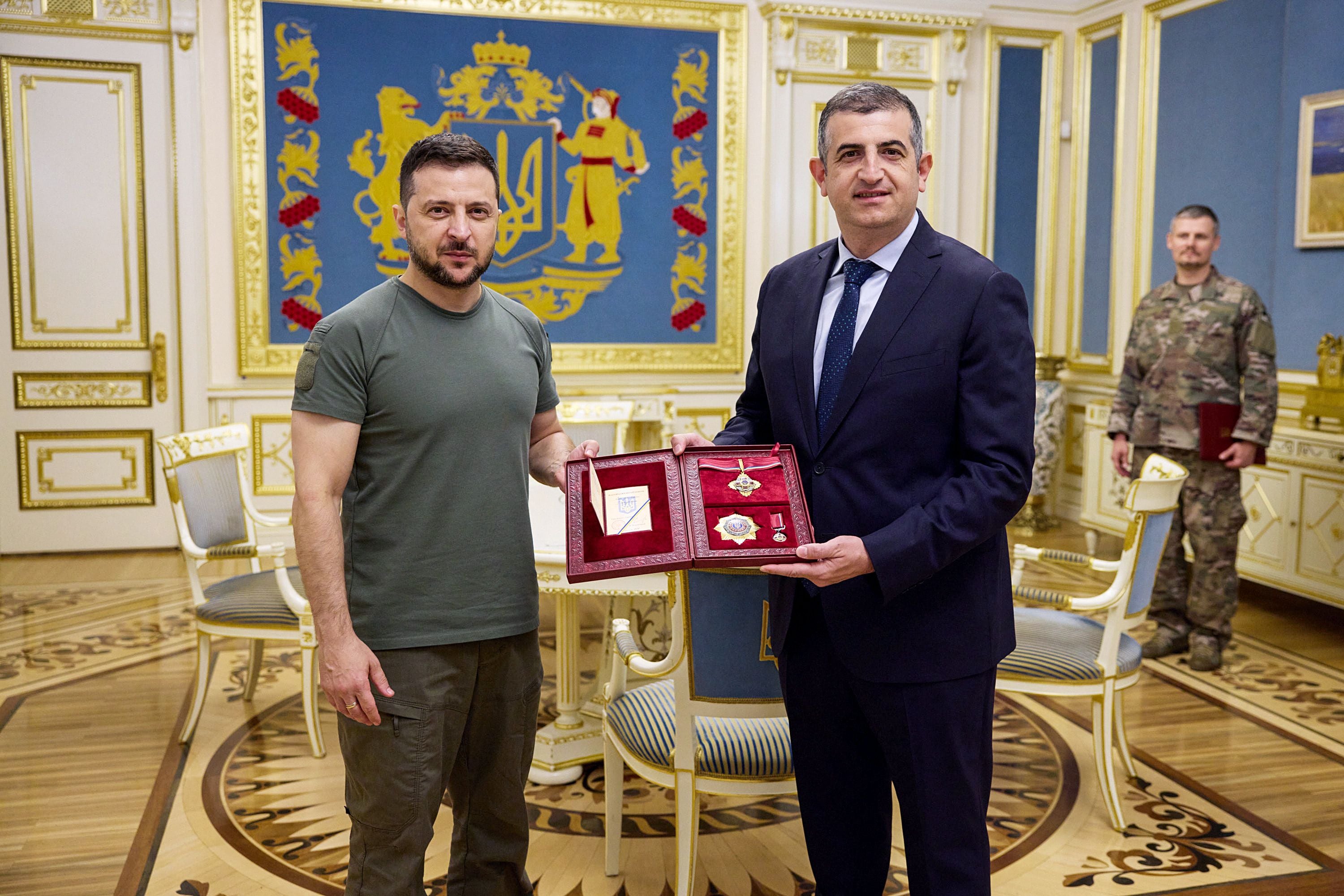 Ukrainian president Volodymyr Zelensky awards the Order of Merit to Baykar Makina Haluk Bayraktar in Kyiv