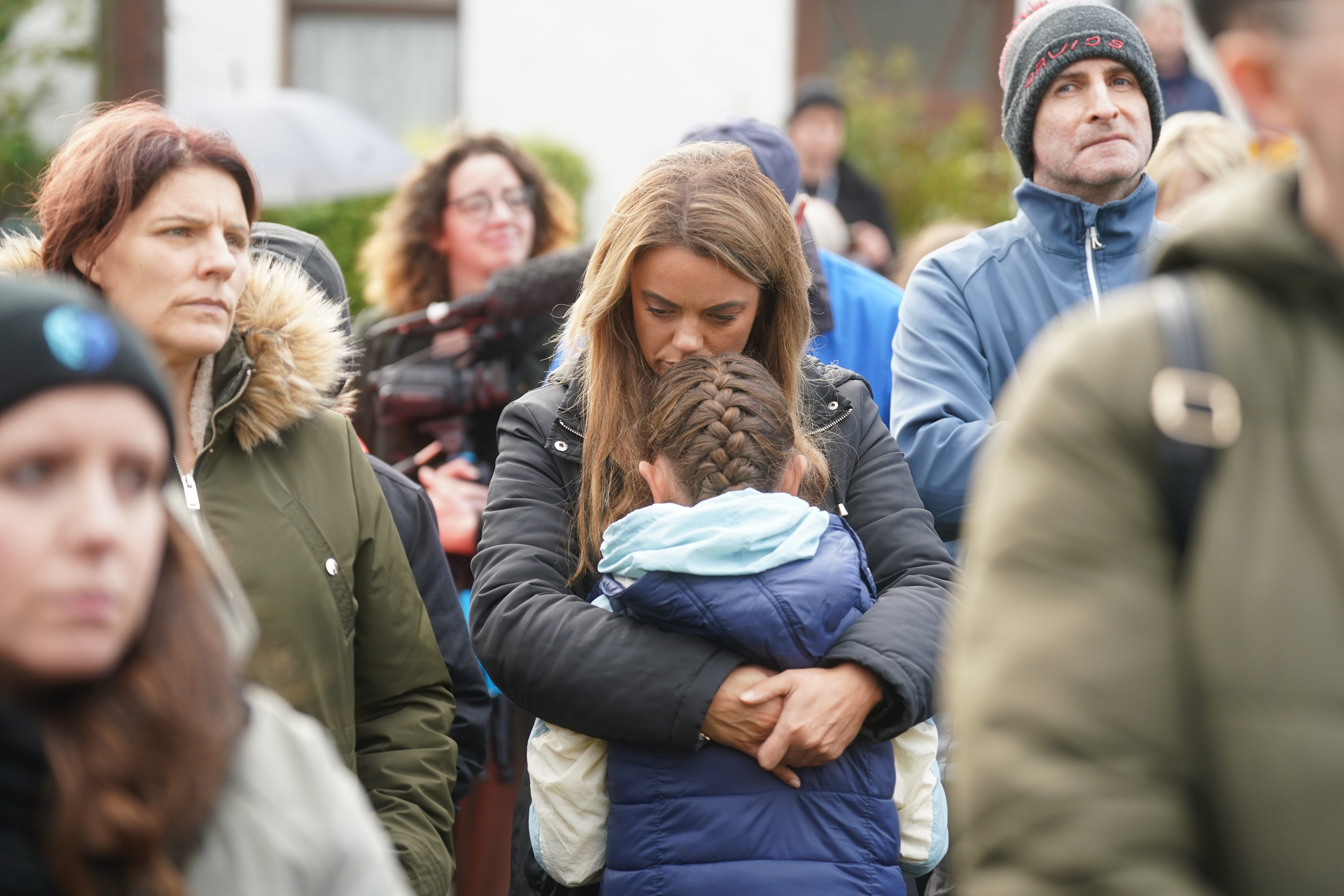 Louise Devine with her daughter Lilly Hegarty, eight, at a vigil in Milford, Co Donegal, for the victims of the Creeslough explosion