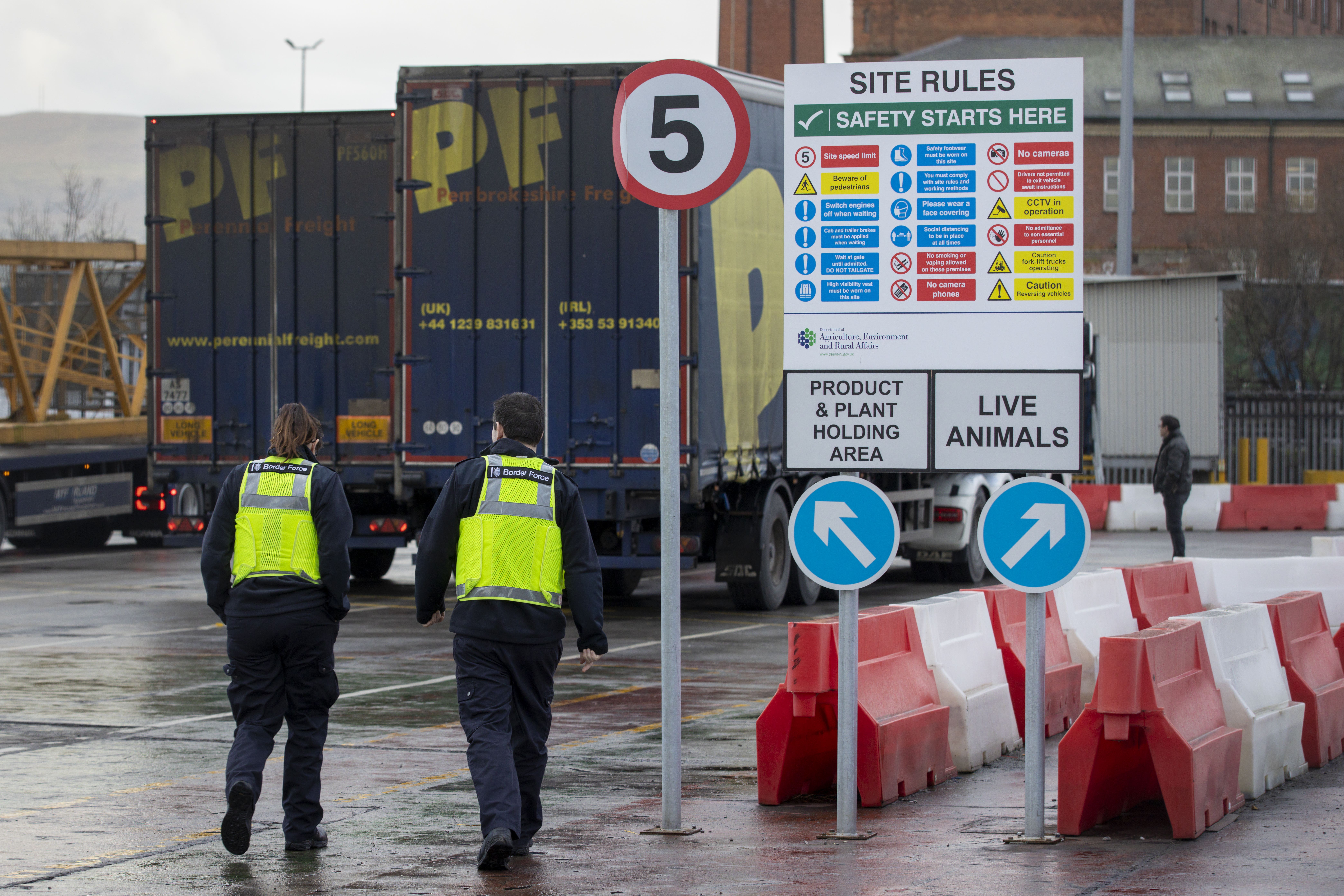UK Border Force officers at the NI Department of Agriculture, Environment and Rural Affairs (DAERA) Northern Ireland Point of Entry (POE) site on Milewater Road in Belfast at the Port of Belfast. Picture date: Monday January 31 2021.