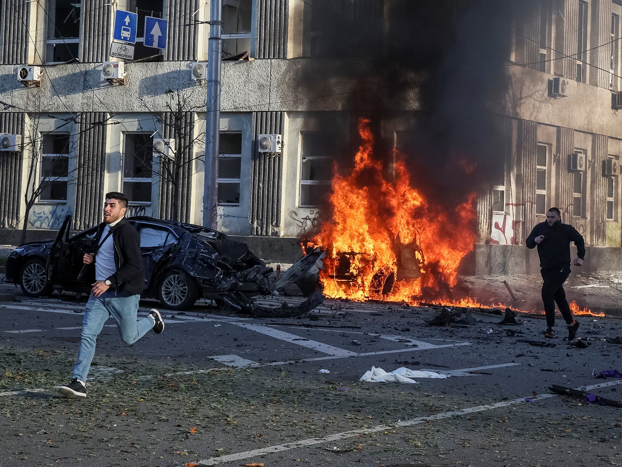 Cars burn after Russian military strike in Kyiv