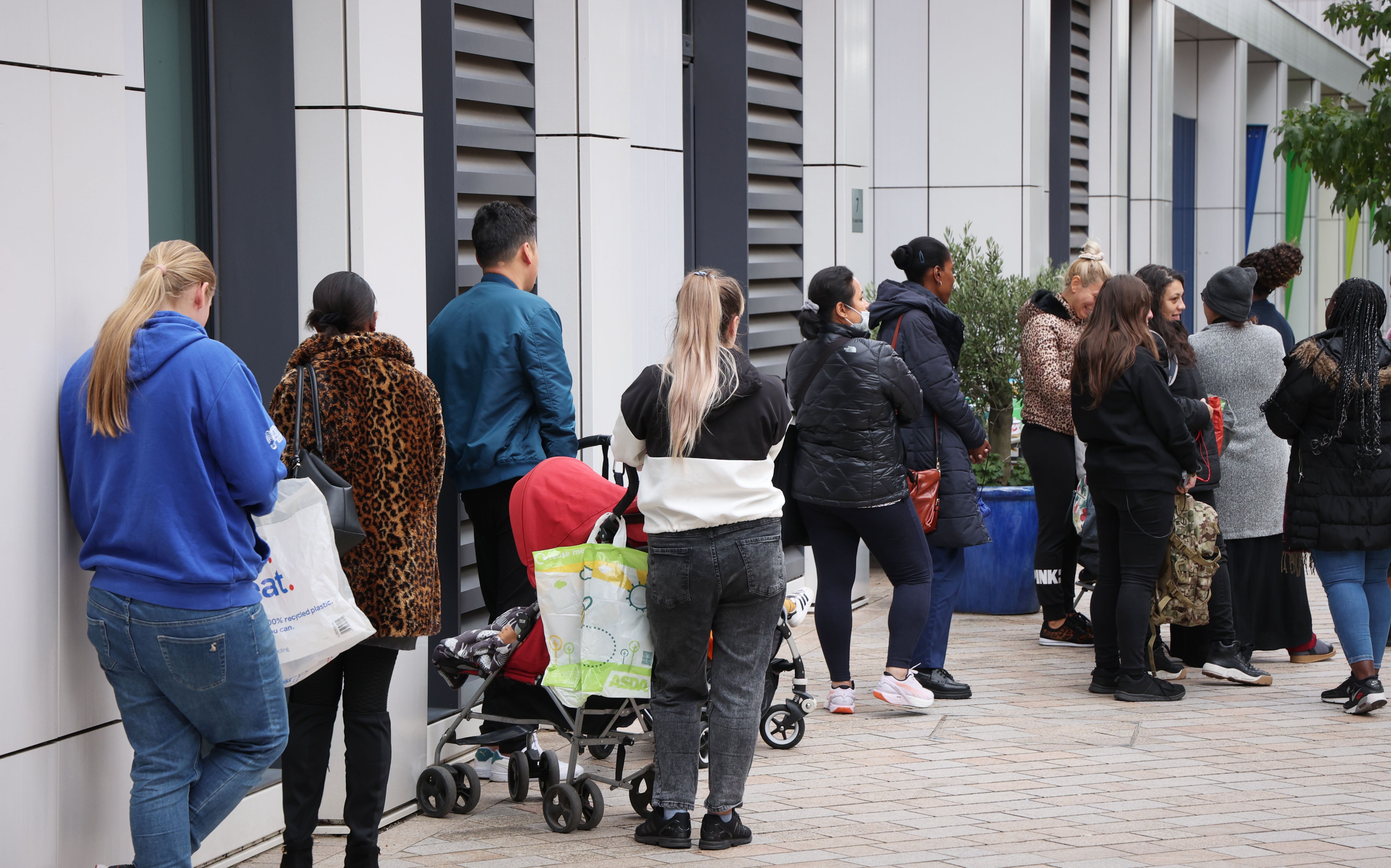 Parents queue for food outside St Mary’s RC Primary School in Battersea, south London