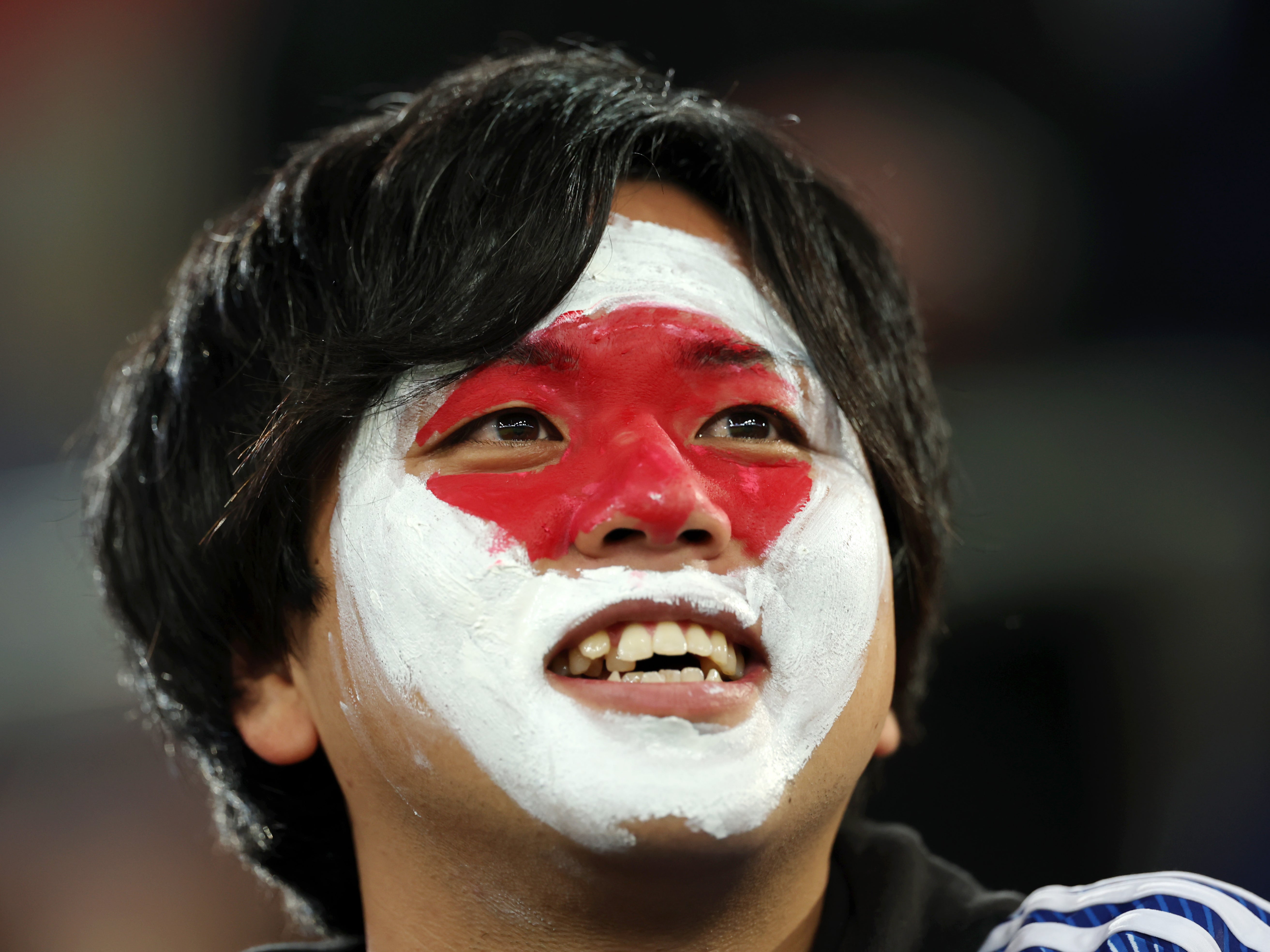 A Japan fan watches on as his nation faces Ecuador in a friendly fixture