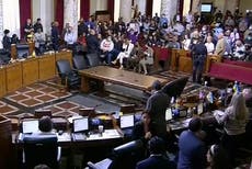 Biden calls for LA council members to quit over racism scandal as chaos breaks out at city meeting