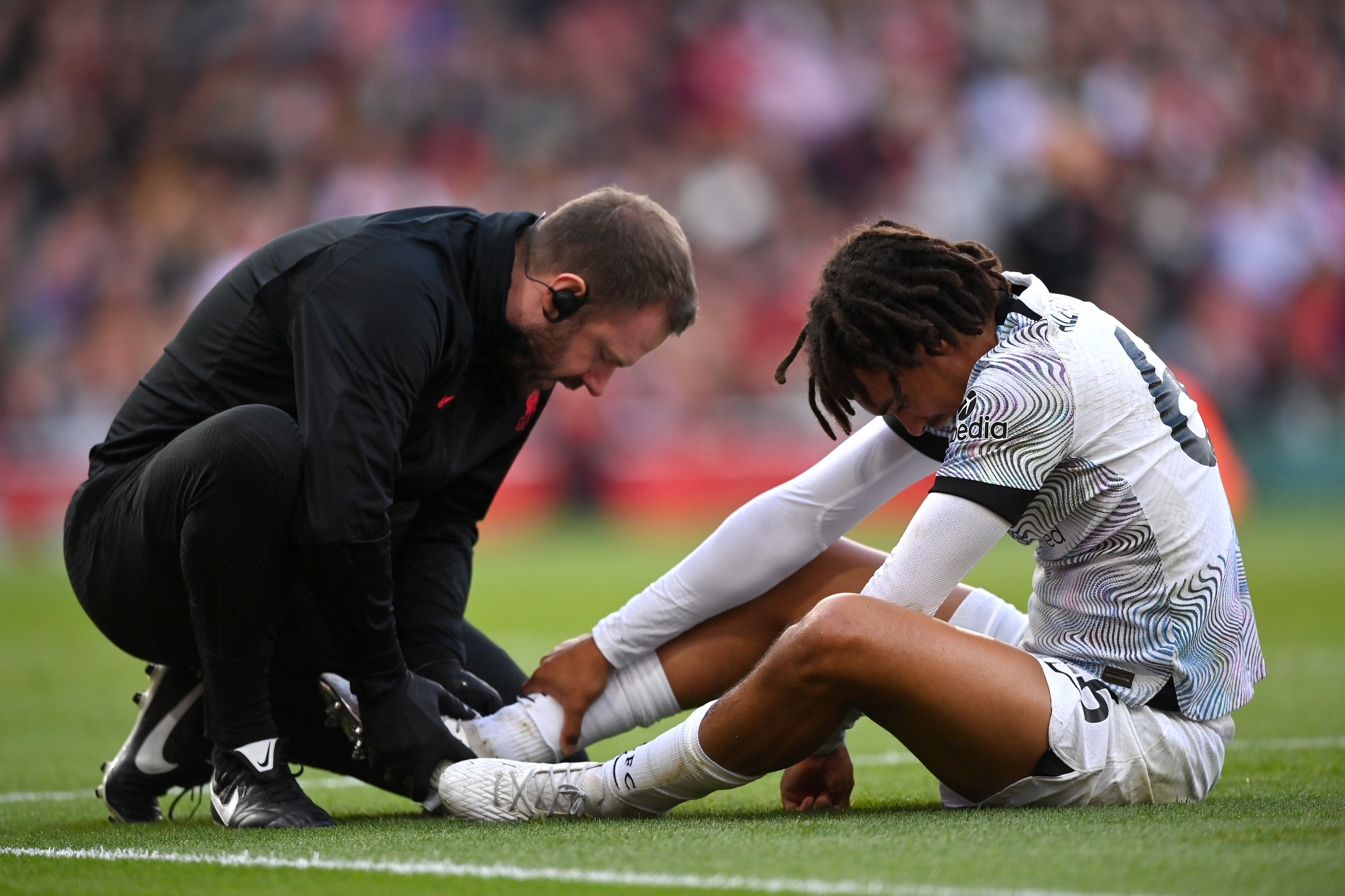 Trent Alexander-Arnold of Liverpool receives treatment