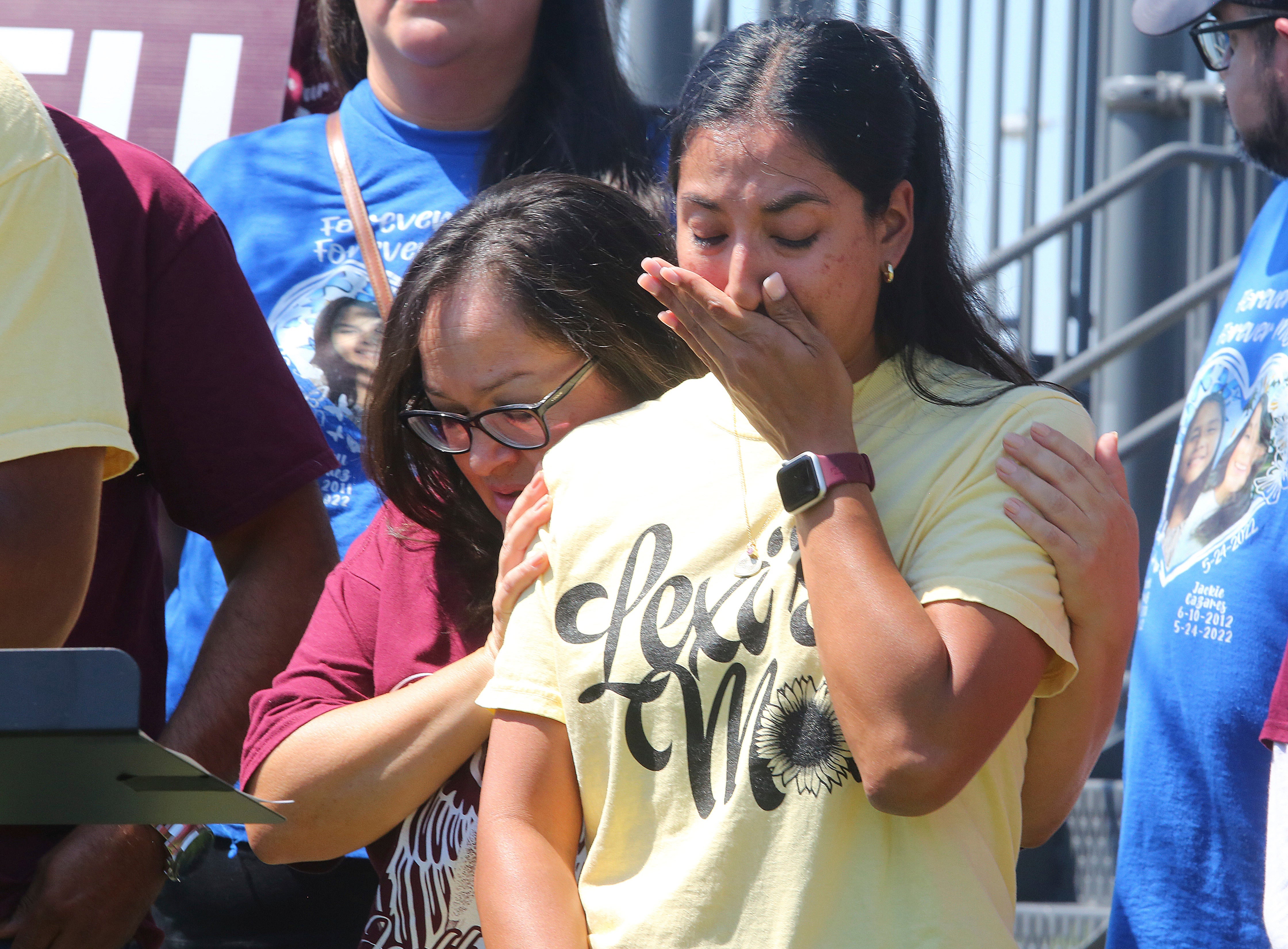 Kimberly Rubio, mother of slain Robb Elementary student Alexandria Rubio, is comforted at a press conference in September