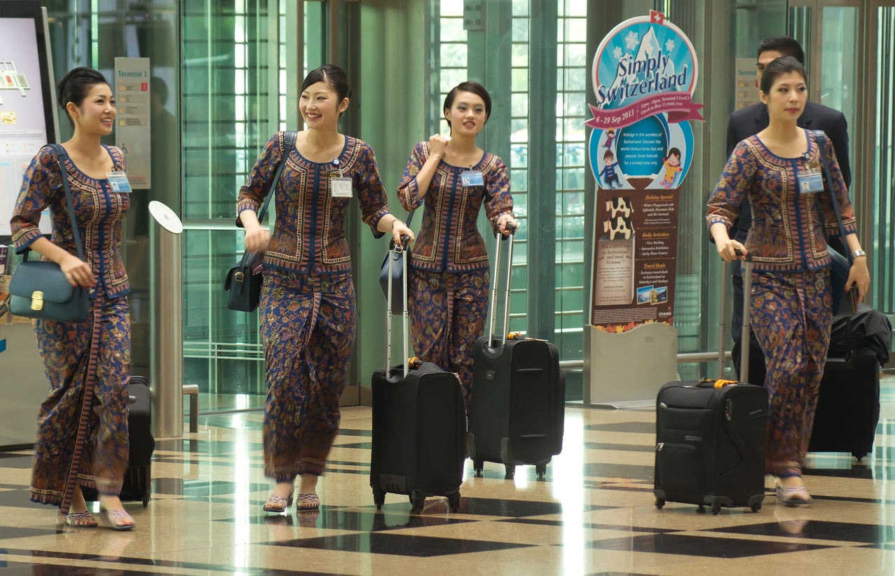 Singapore Airlines crew in their distinctive uniforms