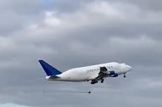 Moment a 100kg wheel falls off massive Boeing Dreamlifter jet