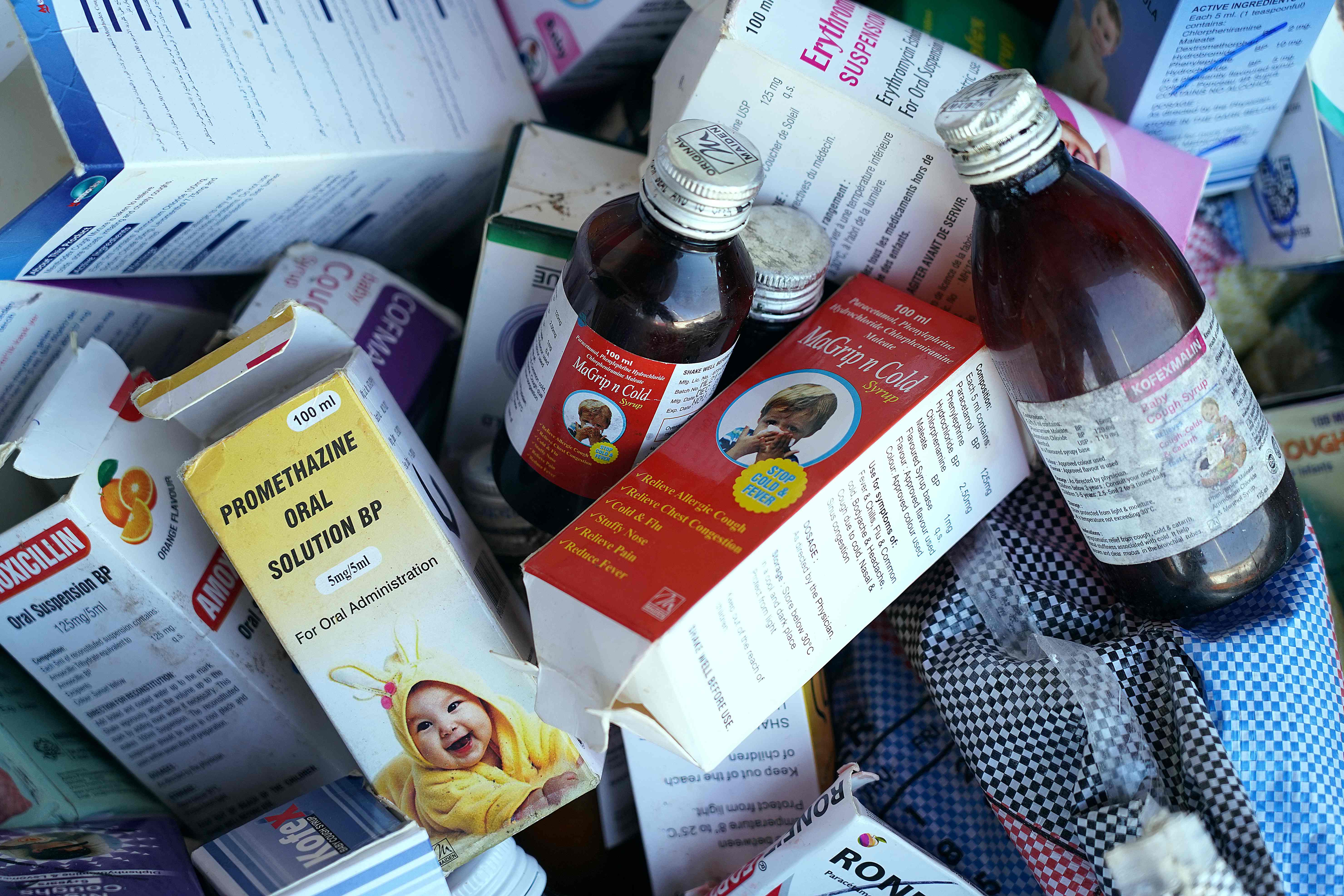 A photograph shows collected cough syrups in Banjul. Indian authorities are investigating cough syrups made by a local pharmaceutical company after the World Health Organisation said they could be responsible for the deaths of 70 children in The Gambia