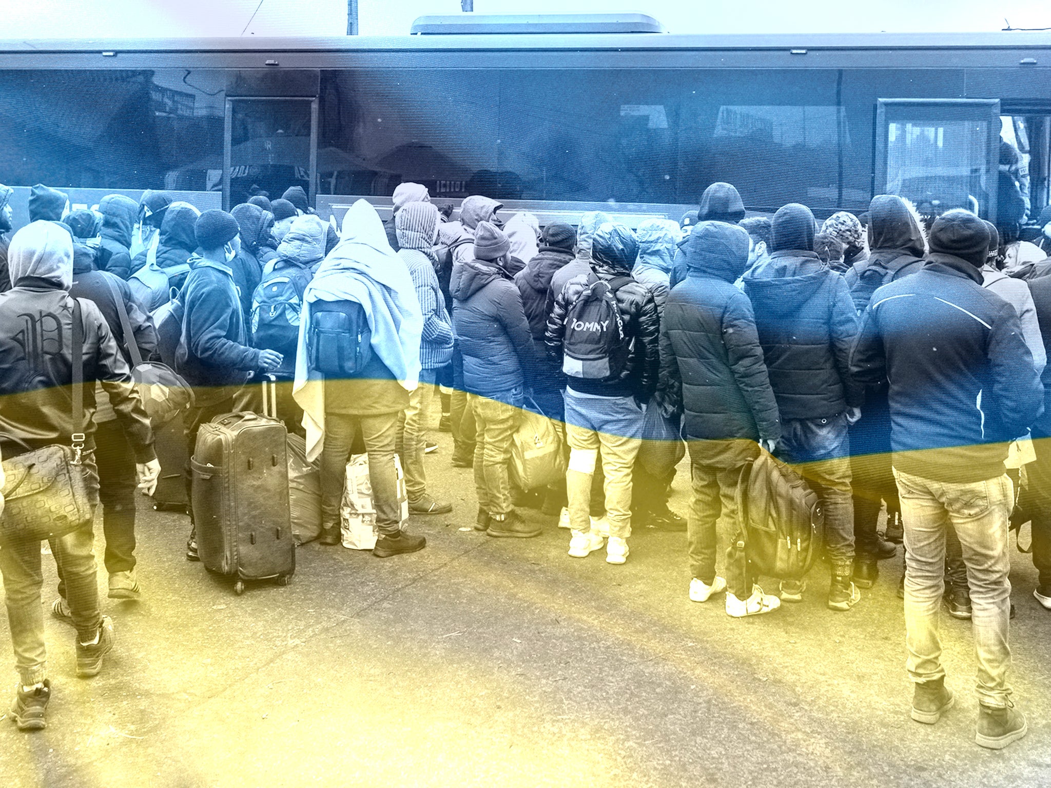 People who have fled the war in Ukraine gather to take a bus at the Medyka pedestrian border crossing in eastern Poland