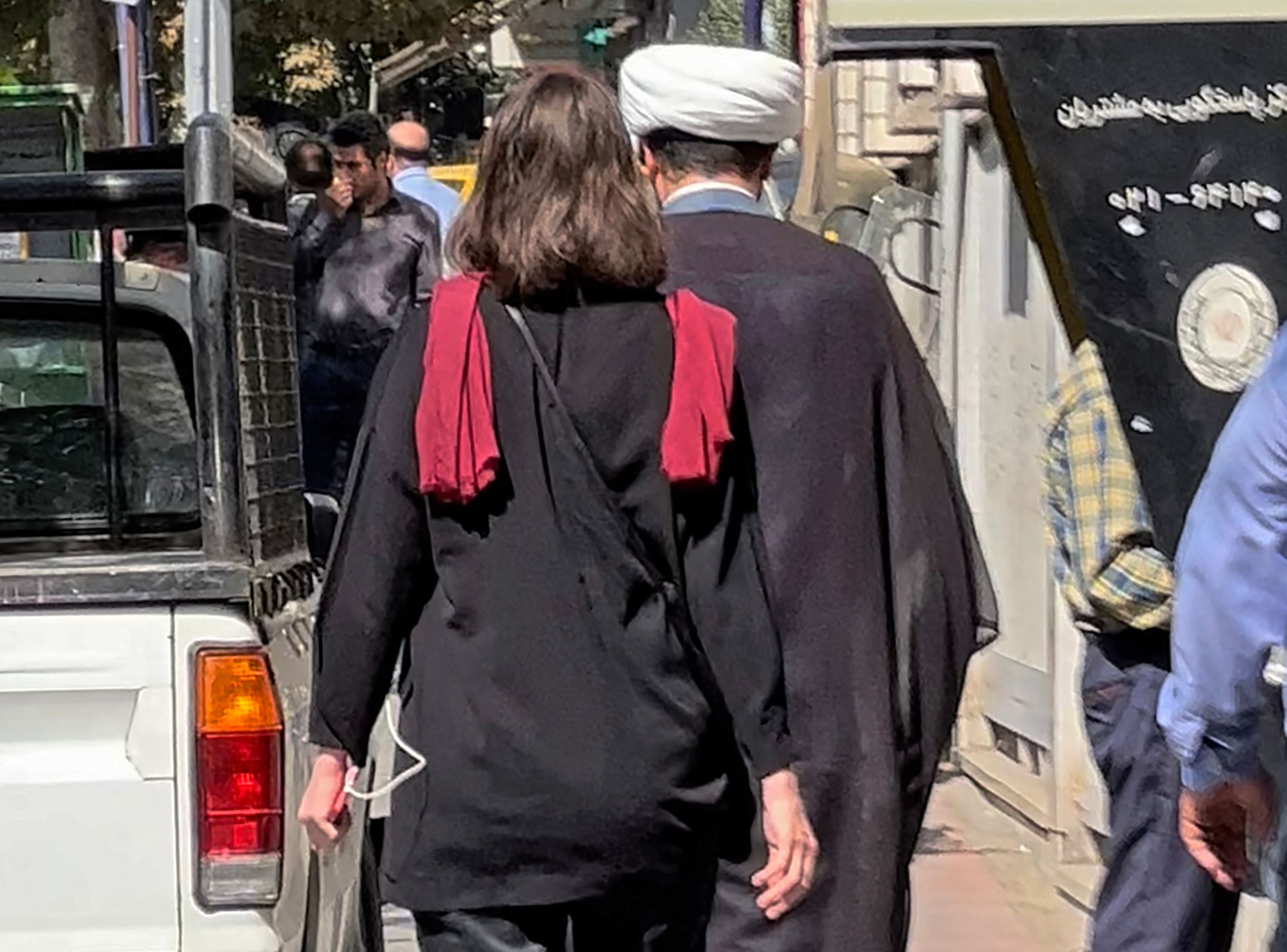 A woman walking without a head scarf in the heart of the Iranian capital Tehran