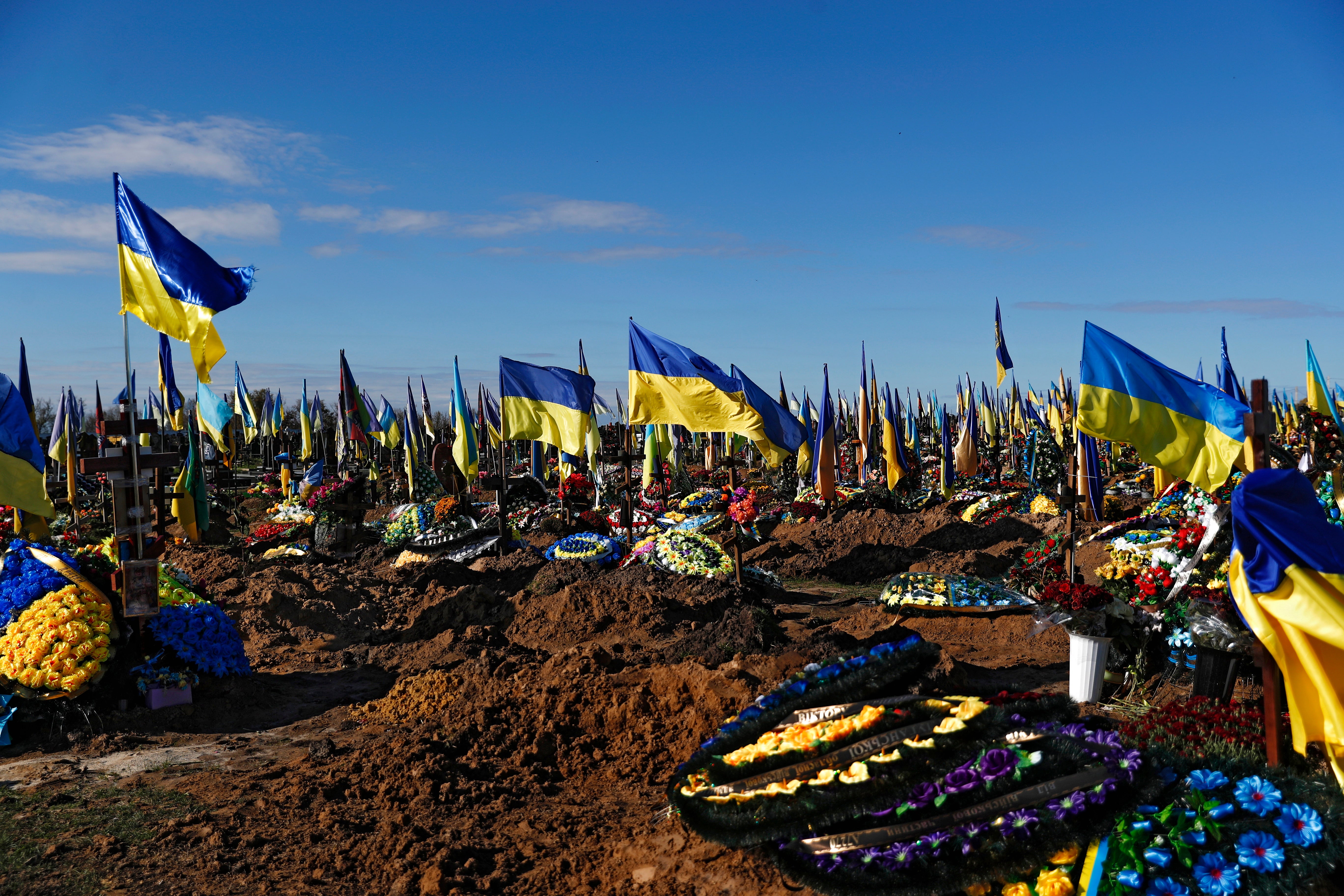 Ukrainian flags at an army cemetery in Kharkiv