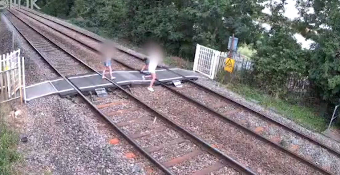 Children playing on the level crossing