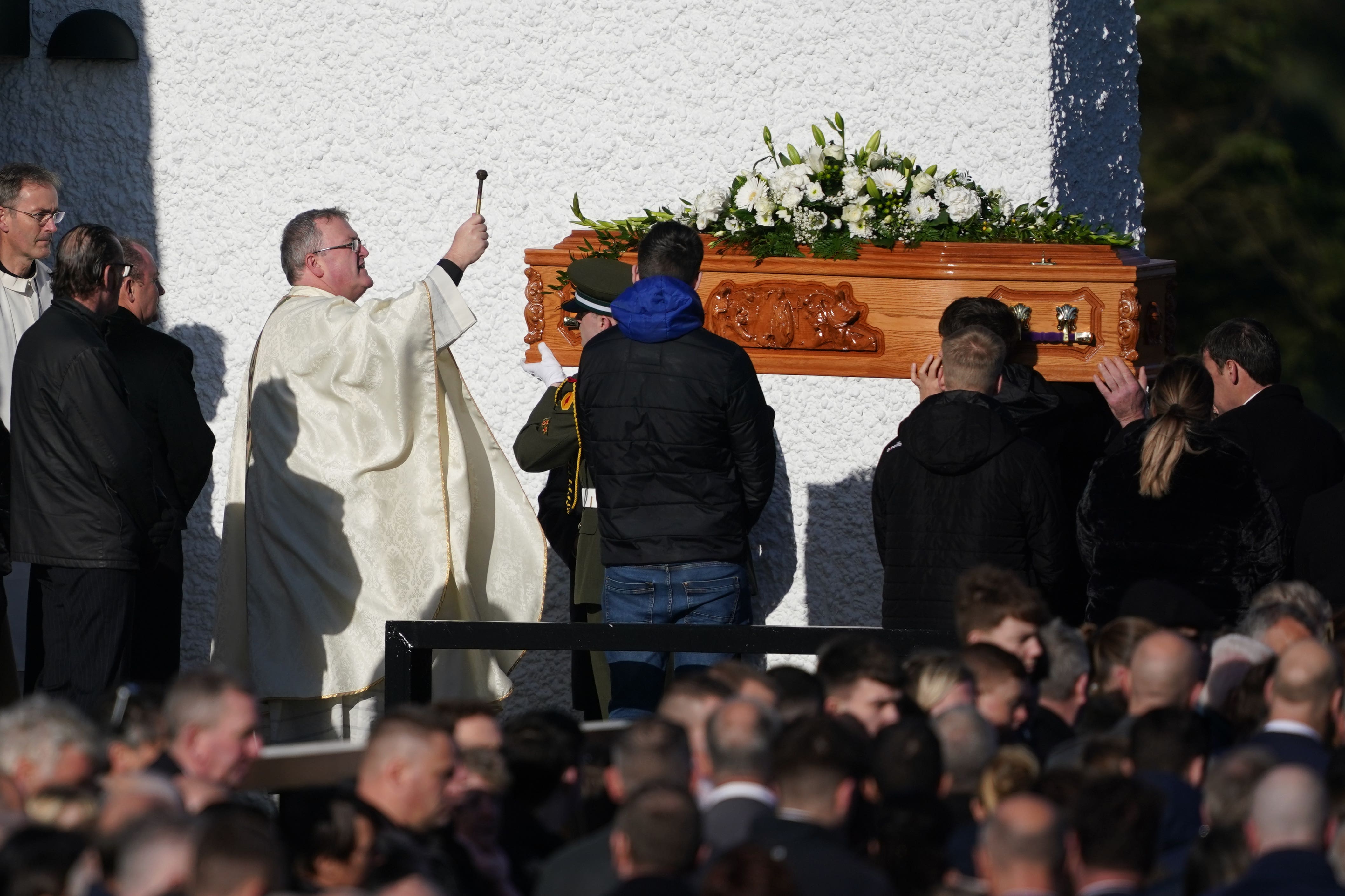 Father John Joe Duffy blesses the coffin of Martina Martin (Brian Lawless/PA)