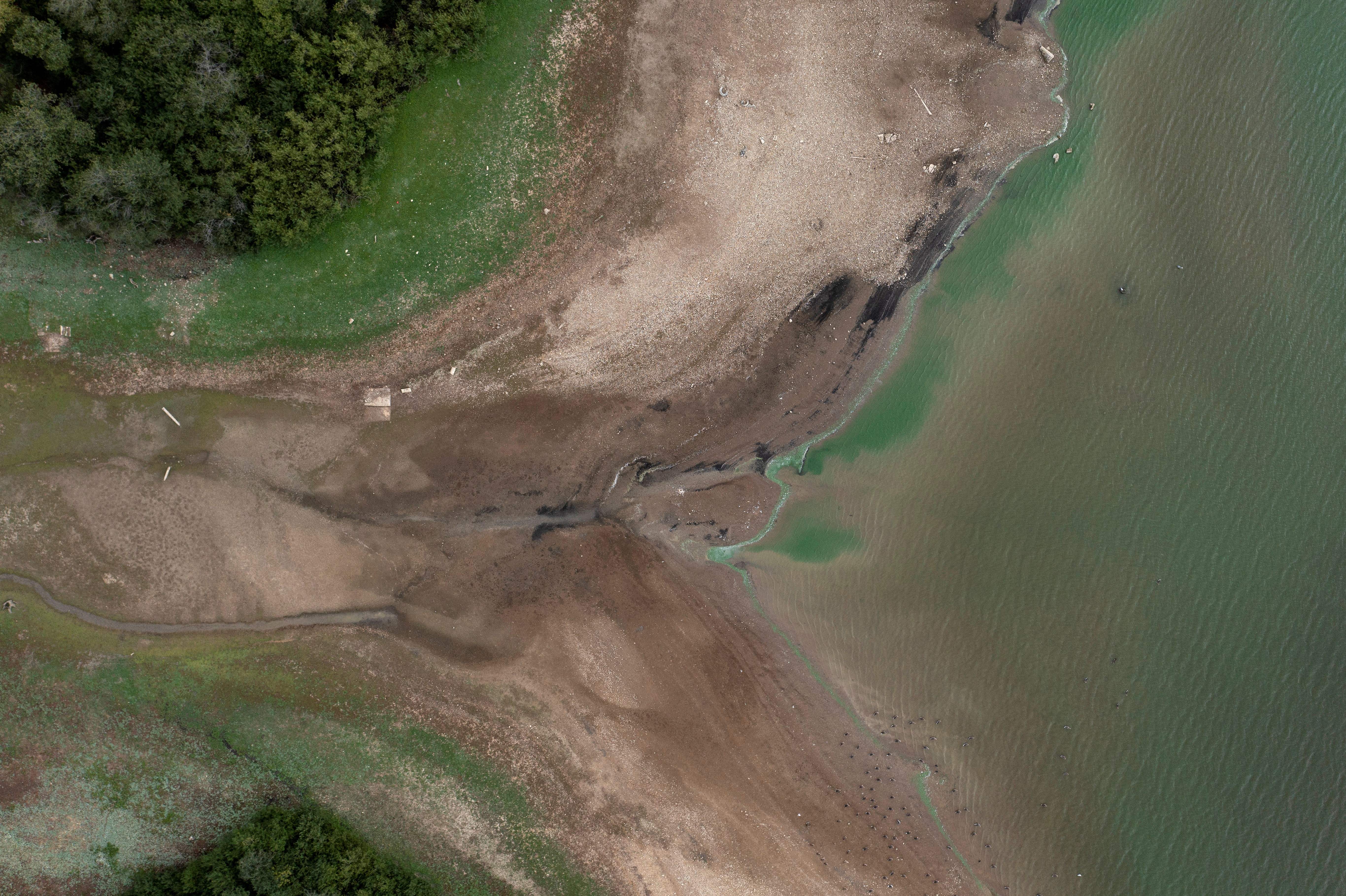 An aerial picture shows low water levels in the Bough Beech Reservoir in Kent on August 23, 2022.