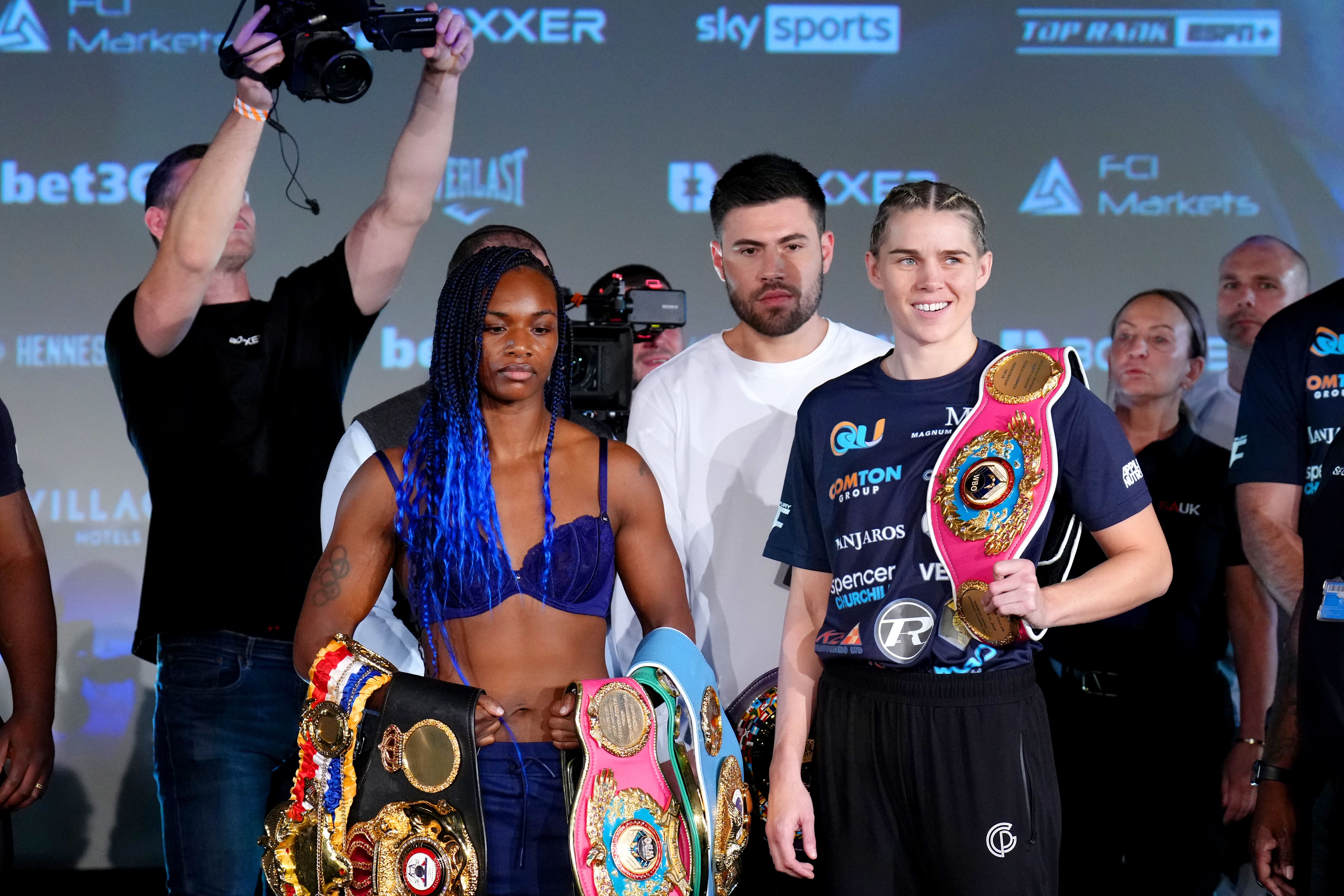 Claressa Shields, left, and Savannah Marshall, right, during the weigh-in on Friday (John Walton/PA)