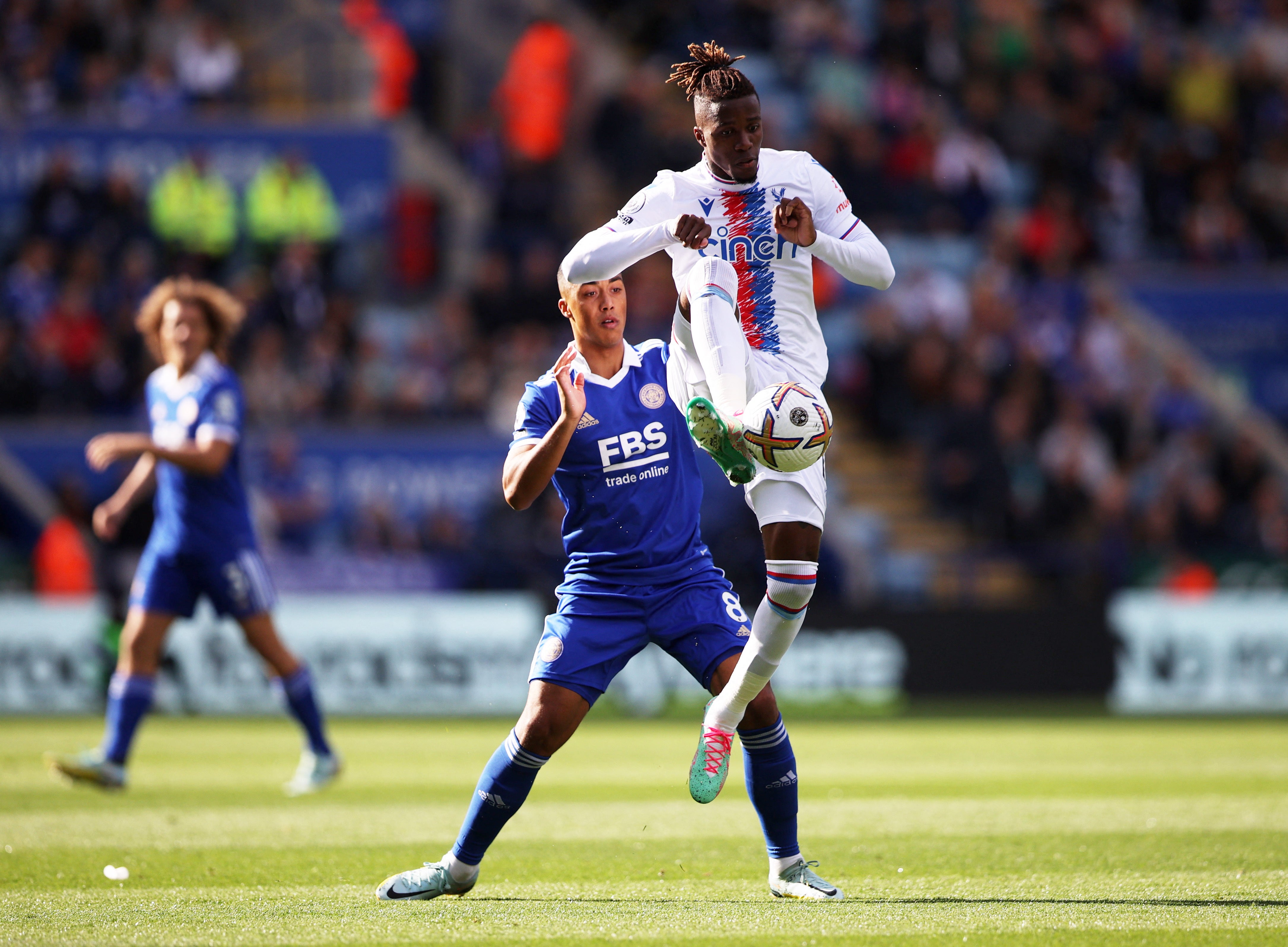 Wilfried Zaha gets his foot on the ball