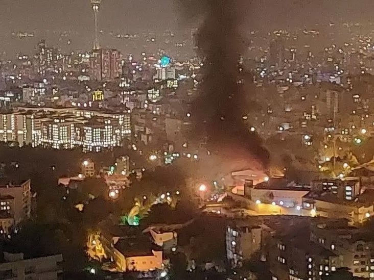 Smoke rising out of Evin prison in Tehran