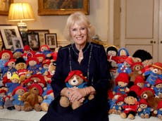 Camilla pictured with dozens of Paddington Bears left as tributes to the Queen