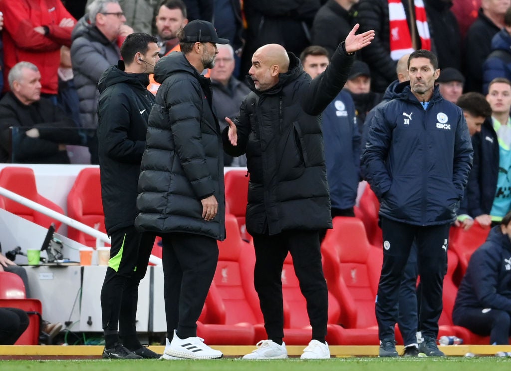 Jurgen Klopp and Pep Guardiola have an exchange of views on the touchline