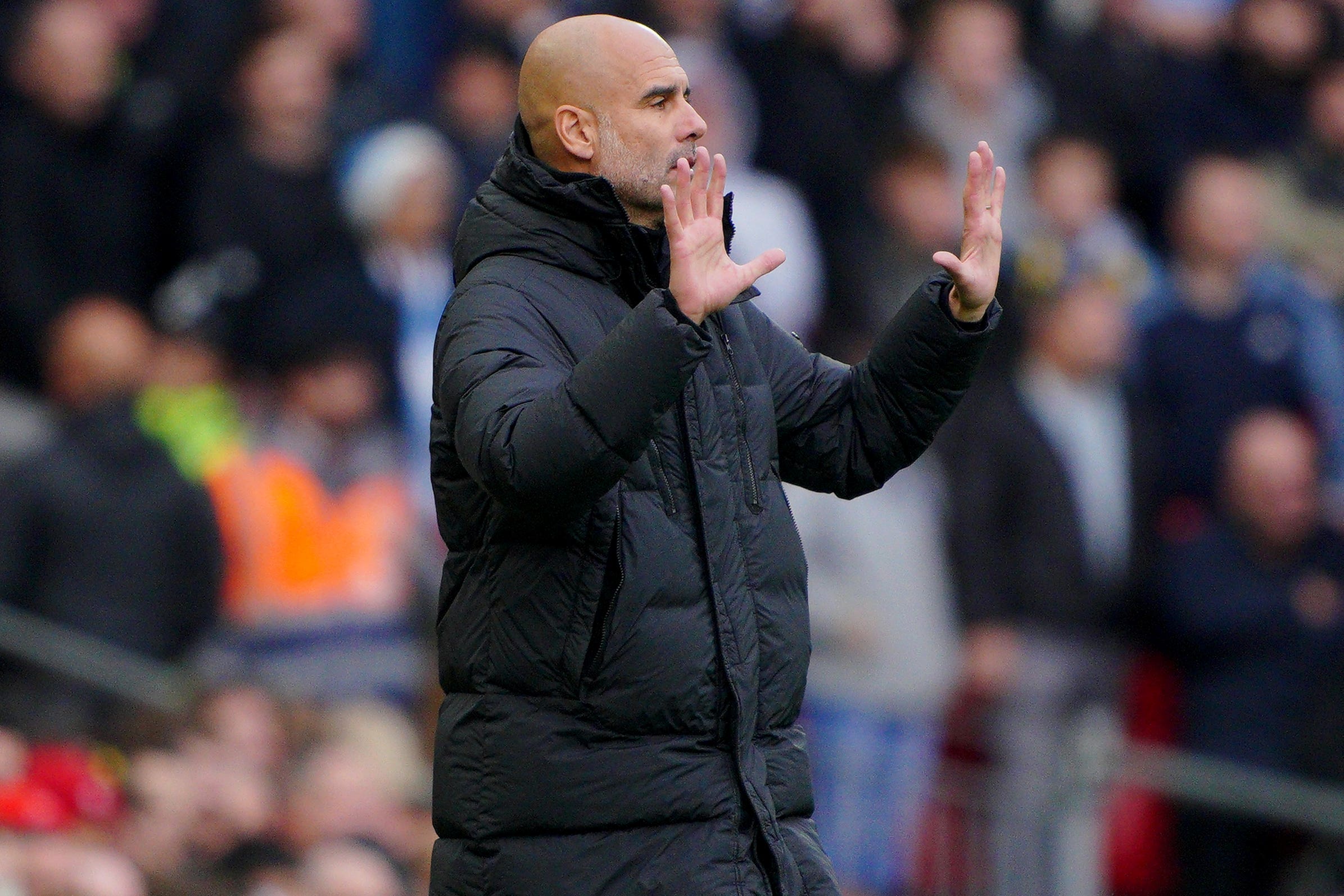 Pep Guardiola had coins thrown at him at Anfield (Peter Byrne/PA)