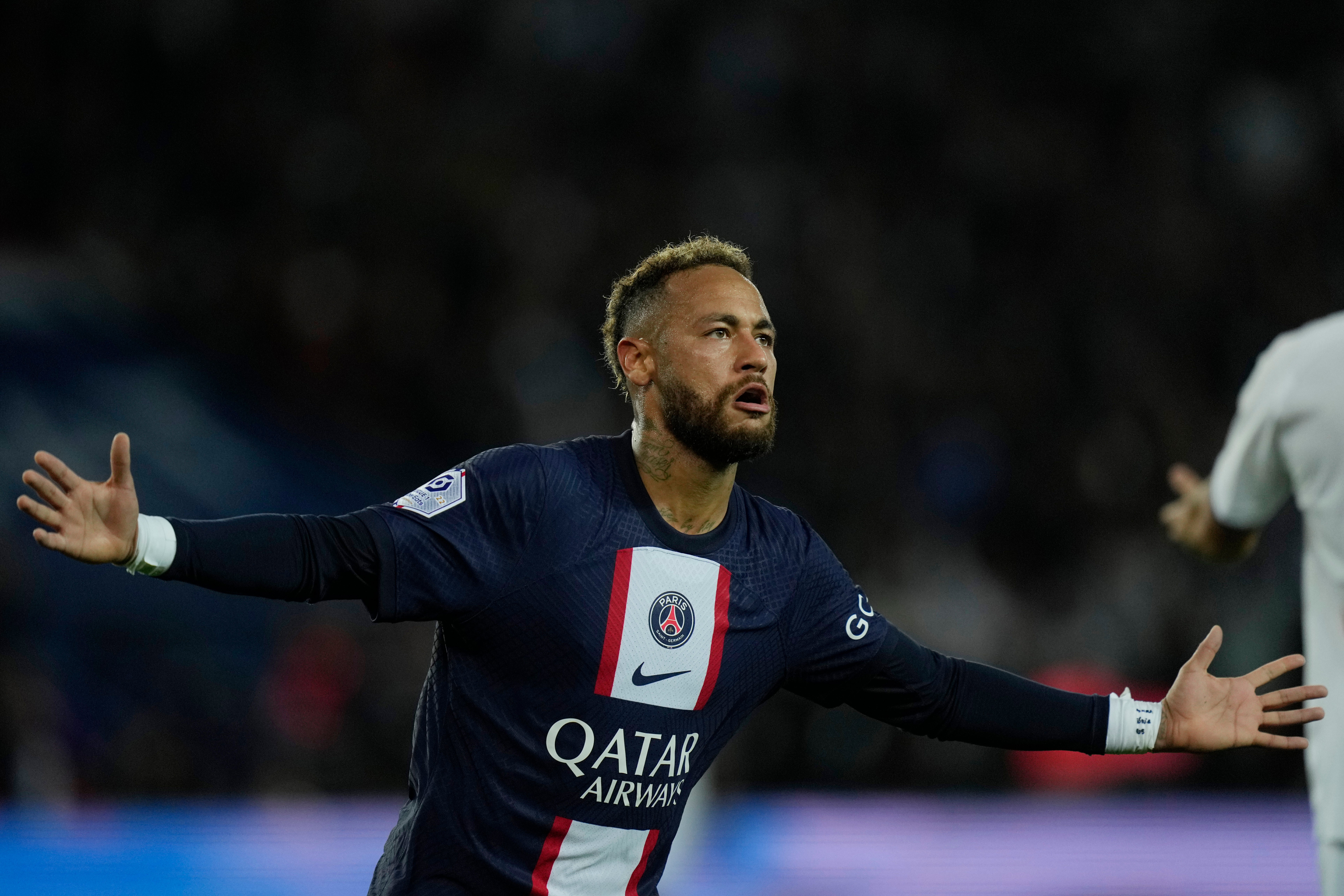 Neymar celebrates scoring the winners against Marseille on Sunday