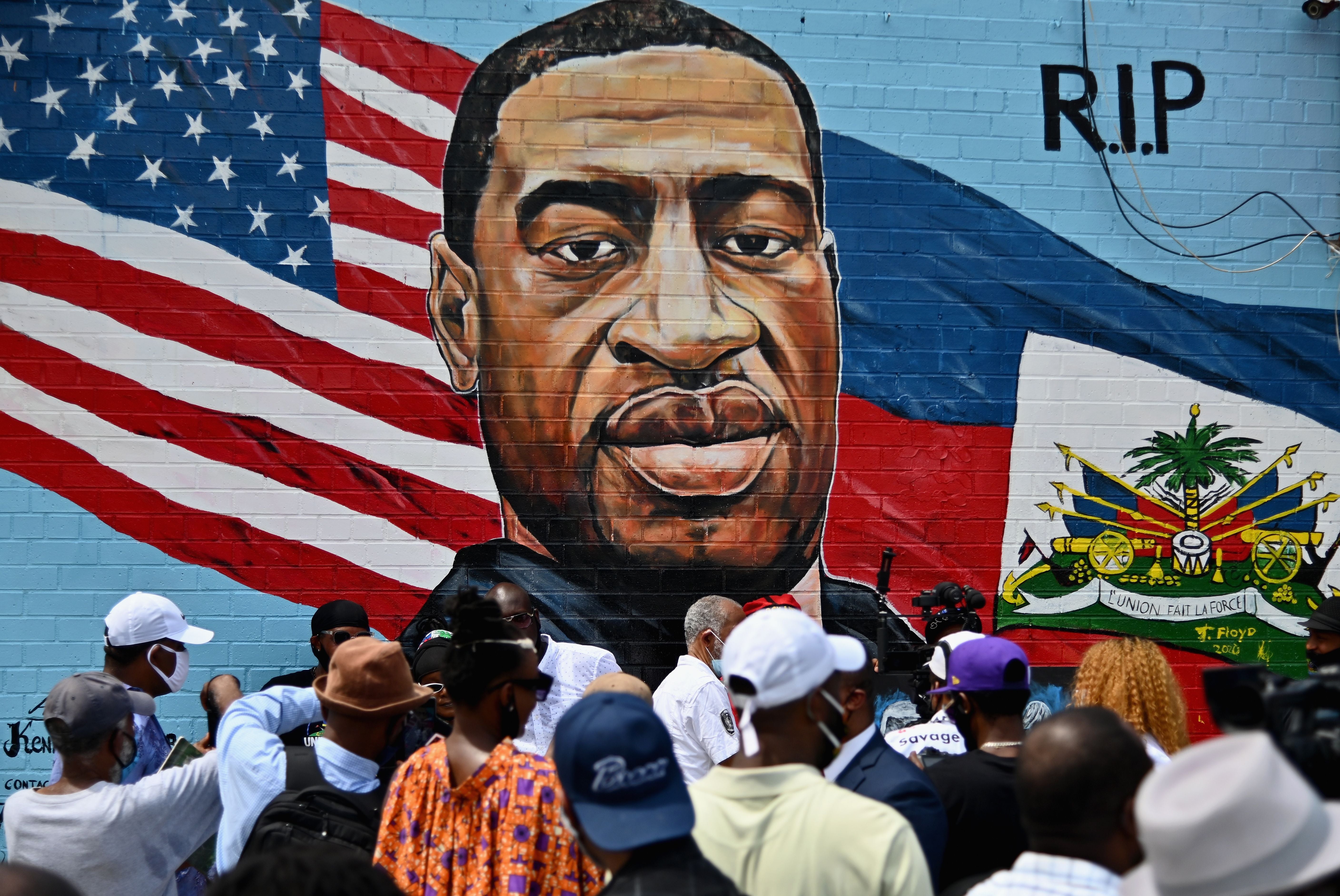 New Yorkers gather at the unveiling of artist Kenny Altidor's memorial portrait of George Floyd in Brooklyn, July 2020