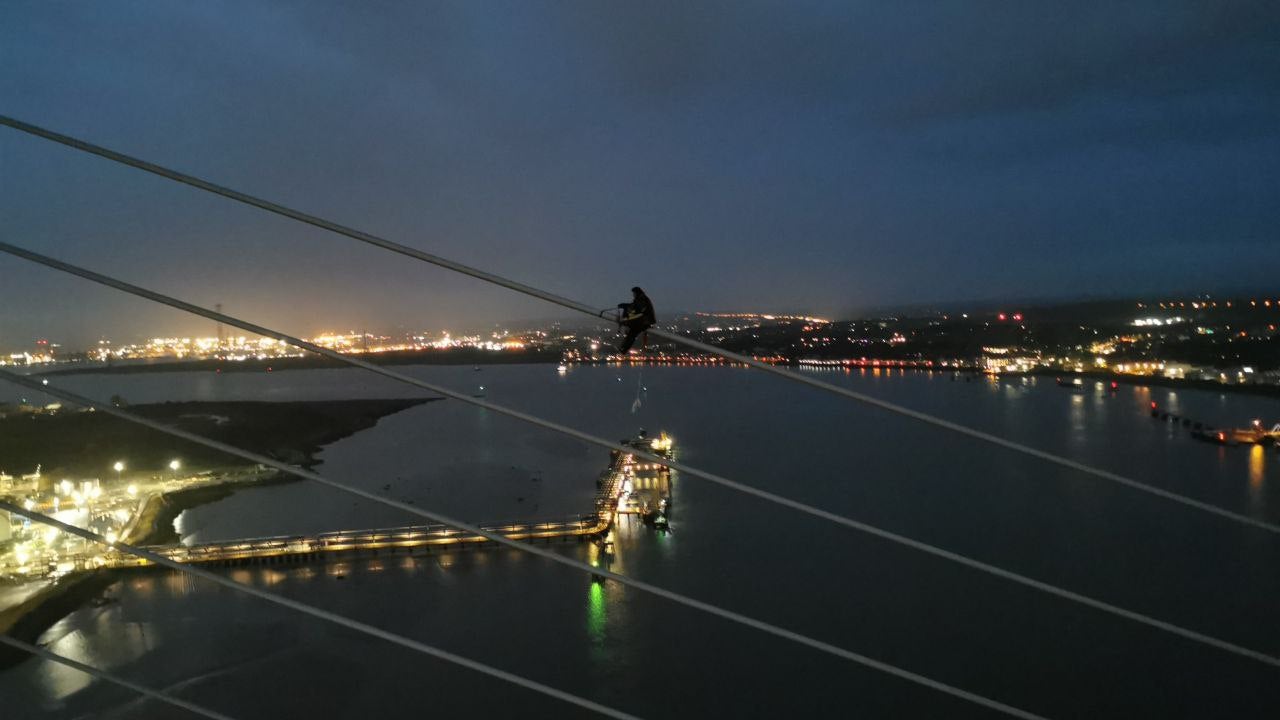 One of the protesters climbing the QEII bridge in the early hours of this morning