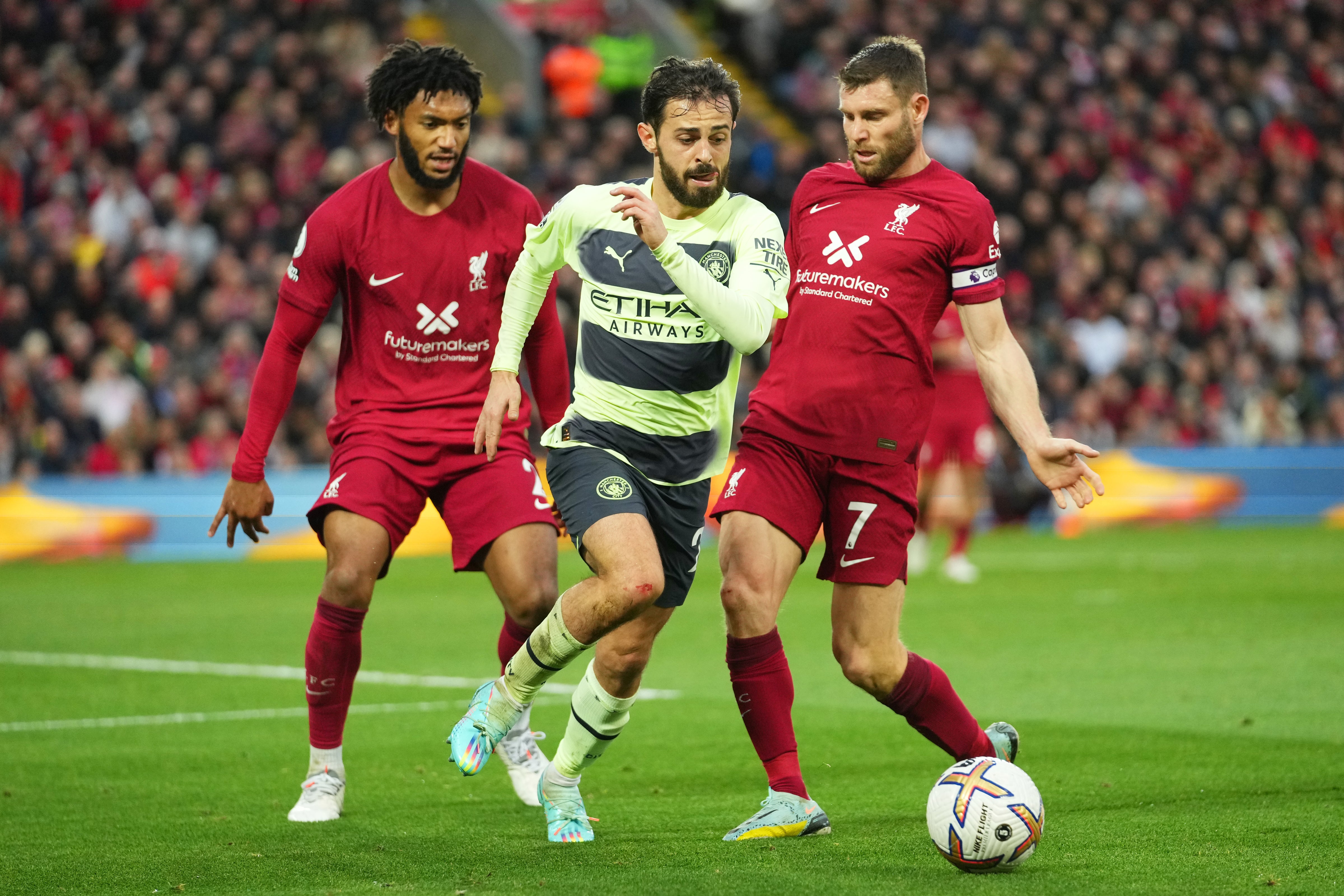 Gomez and Milner challenge Bernardo Silva at Anfield on Sunday