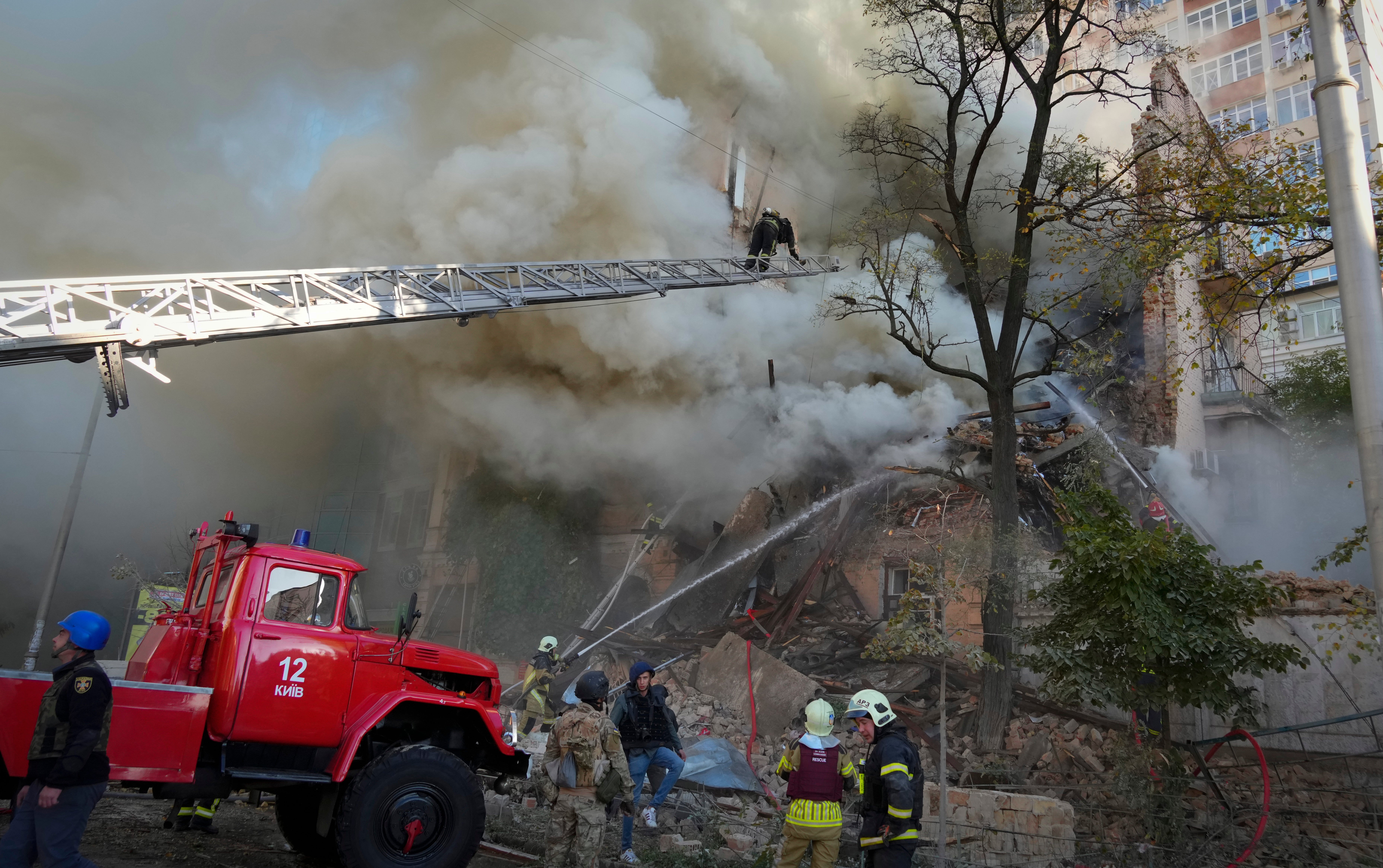 Firefighters tackle a blaze in an apartment block in Kyiv on Monday